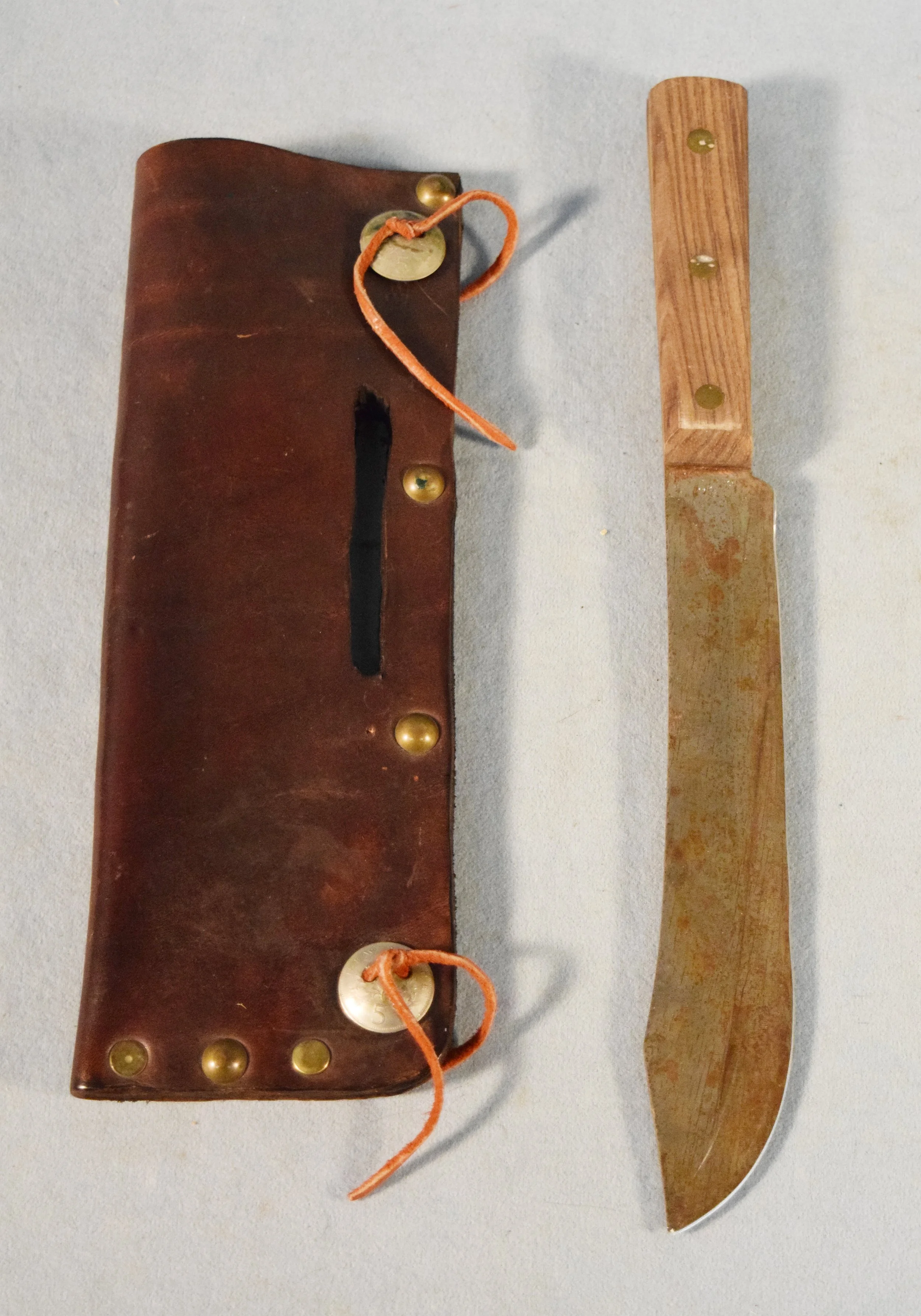 Handmade knife with leather sheath with small conchos, 8" blade, wooden handle