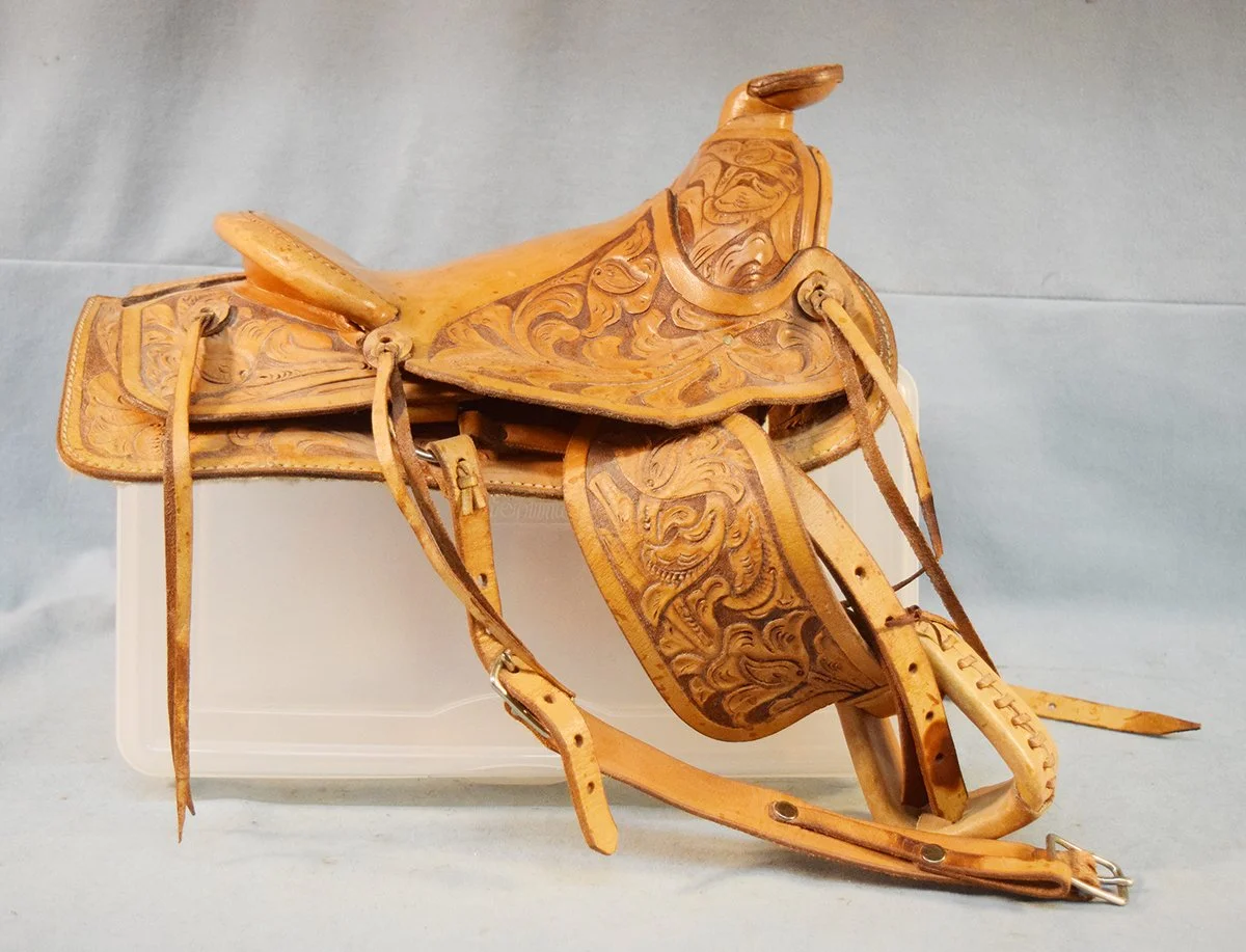 Miles City Saddlery Salesman sample made by Bill Perschillo, 7" seat, flower tooled, 1979 National Finals Rodeo, Oklahoma City 
