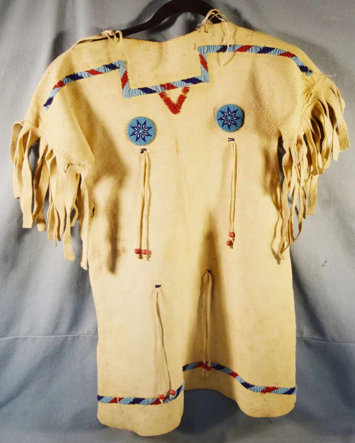 Child's buckskin dress, some beaded trim
