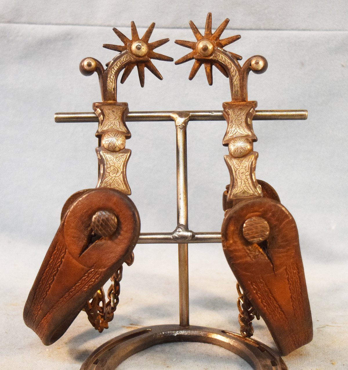 Fancy inlaid silver inlaid spurs w/double chains , iron engraved. Attributed to Etchatvaria, California
