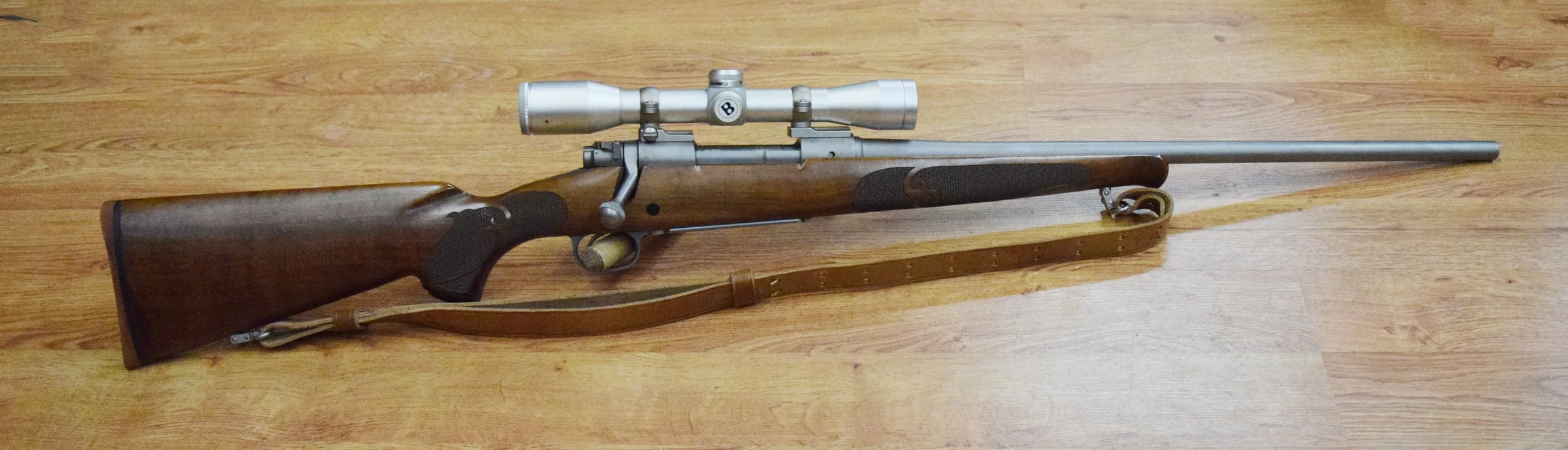 Winchester Model 70 bolt-action rifle, converted to .338-06, s# G156891, Bushnell Sportview scope, leather sling
