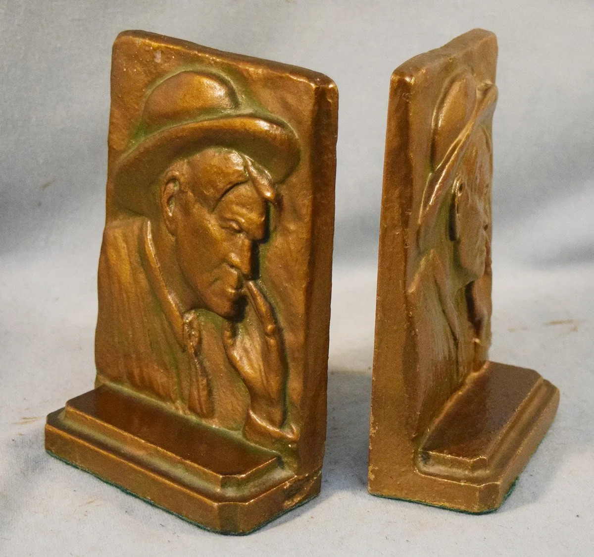 Charlie Russell self portrait bronze bookends, 6 ¾" x 4½" x 2½", rare
