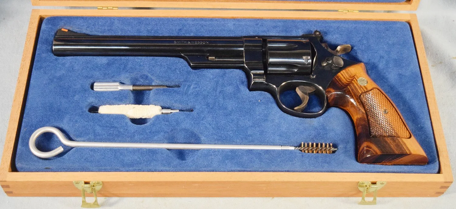 Smith & Wesson Model 25-5, 45 Colt, 8½" barrel, wood grip, wooden case with cleaning rod, s#N659764