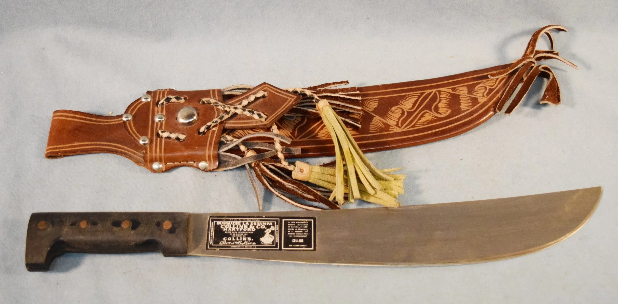 Fancy leather sheath & knife. Knife is by Sam W. Collins, Collins & Co., Hartford, 14", Busquese La Estampa. Sheath has a "G" stamp