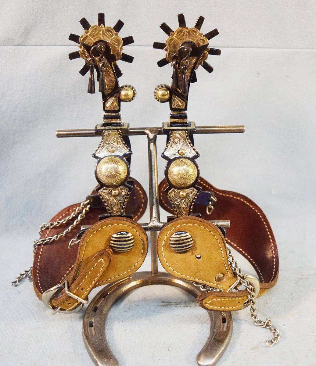 Garcia silver mounted spurs with jingel bobs and rein chains
