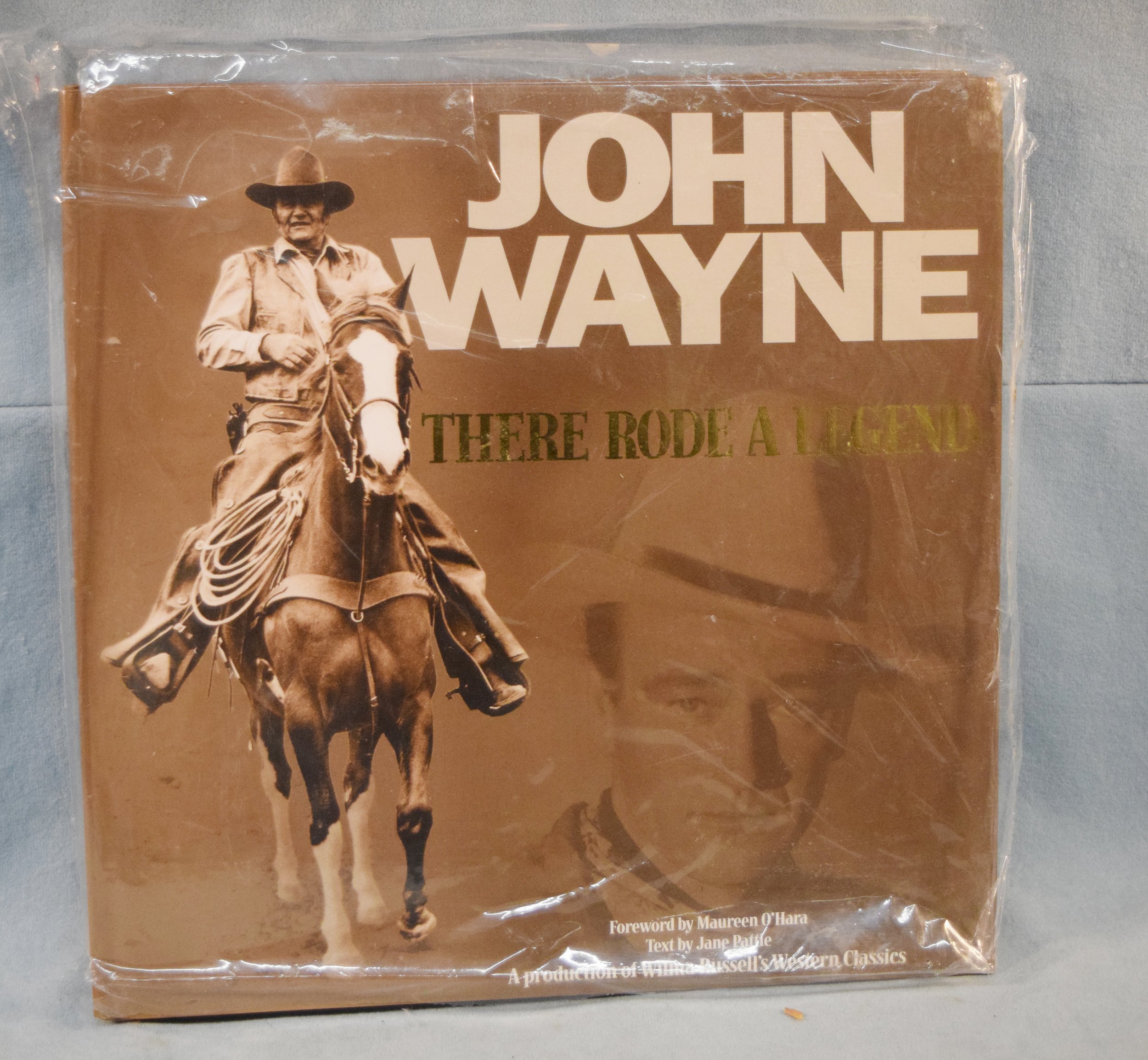 John Wayne – There Rode a Legend, A production of Wilma Russell's Western Classics, copyright 2000, signed by the wife of John Wayne's business partner