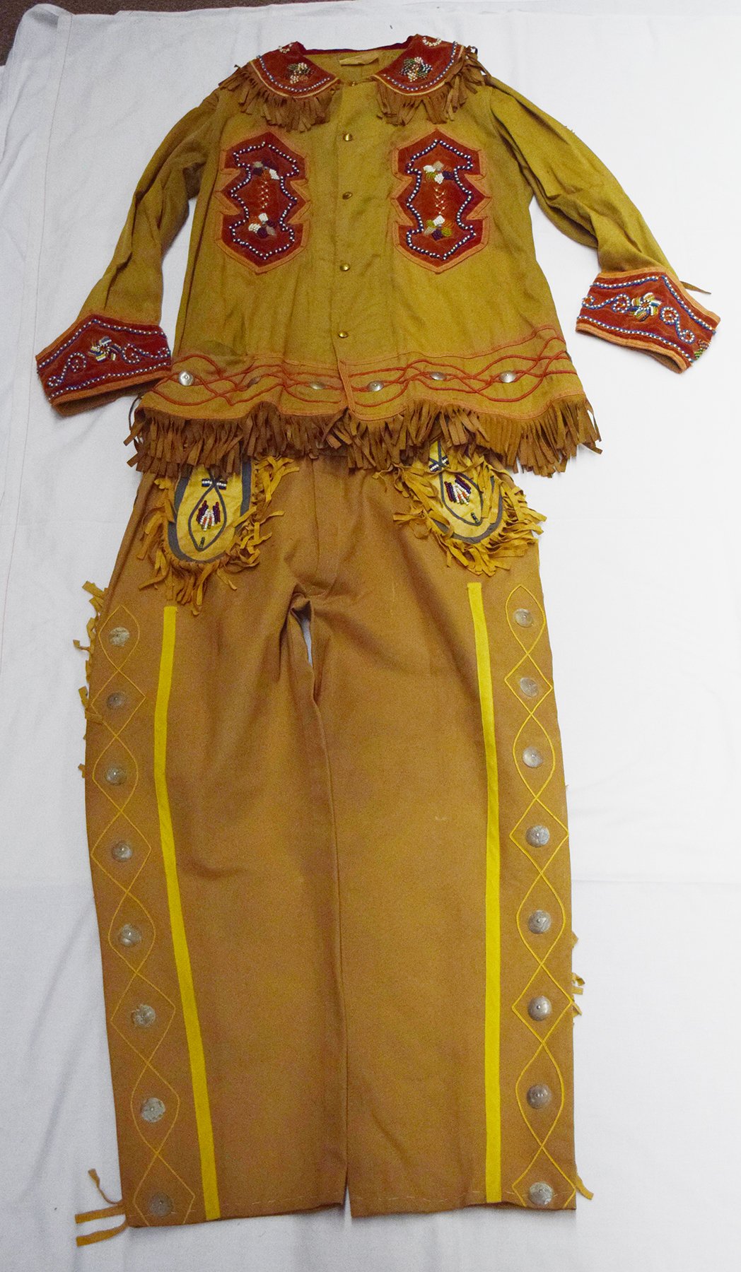 Authentic Buffalo Bill Cody Wild West Show costume, Anne Stavrou pants and jacket, trunk containing dress was found in basement of a bank in Cincinatti, OH. Originally part of the Jerry & Vangie Lee collection. Sold to Gary Jacobson
