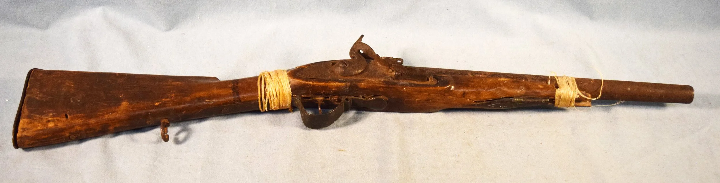 Early Flintlock Buffalo Runner. First repeaters of the plains. Shows Indian use. Indians would put several balls in their mouths while running buffalo and would spit balls down the barrel. Horse tracks under the forearm. From the Tom Waught Collectio