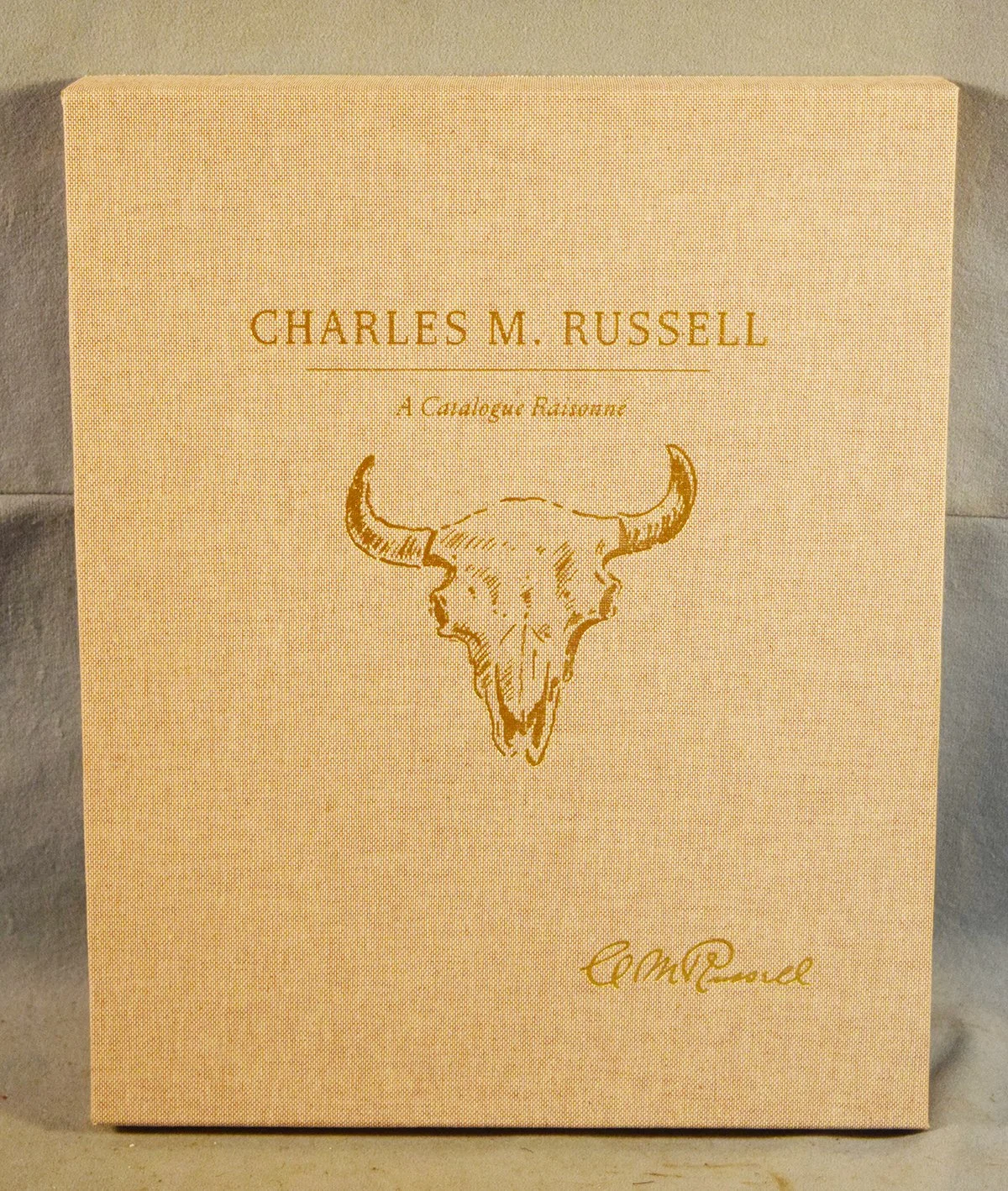 Charles M. Russell, A Catalogue Raisonne, edited by Byron Price, limited edition, #87/500, leather bound in slip cover, signed by the seven contributors, mint condition, very collectible
