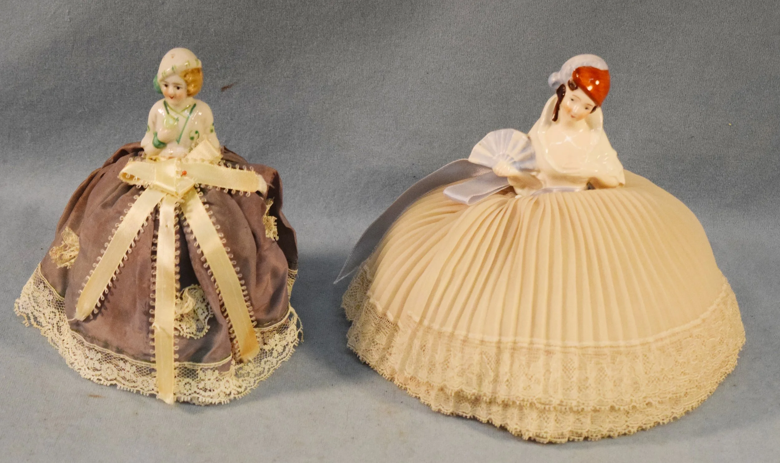 (2) Vintage porcelain doll pin cushions