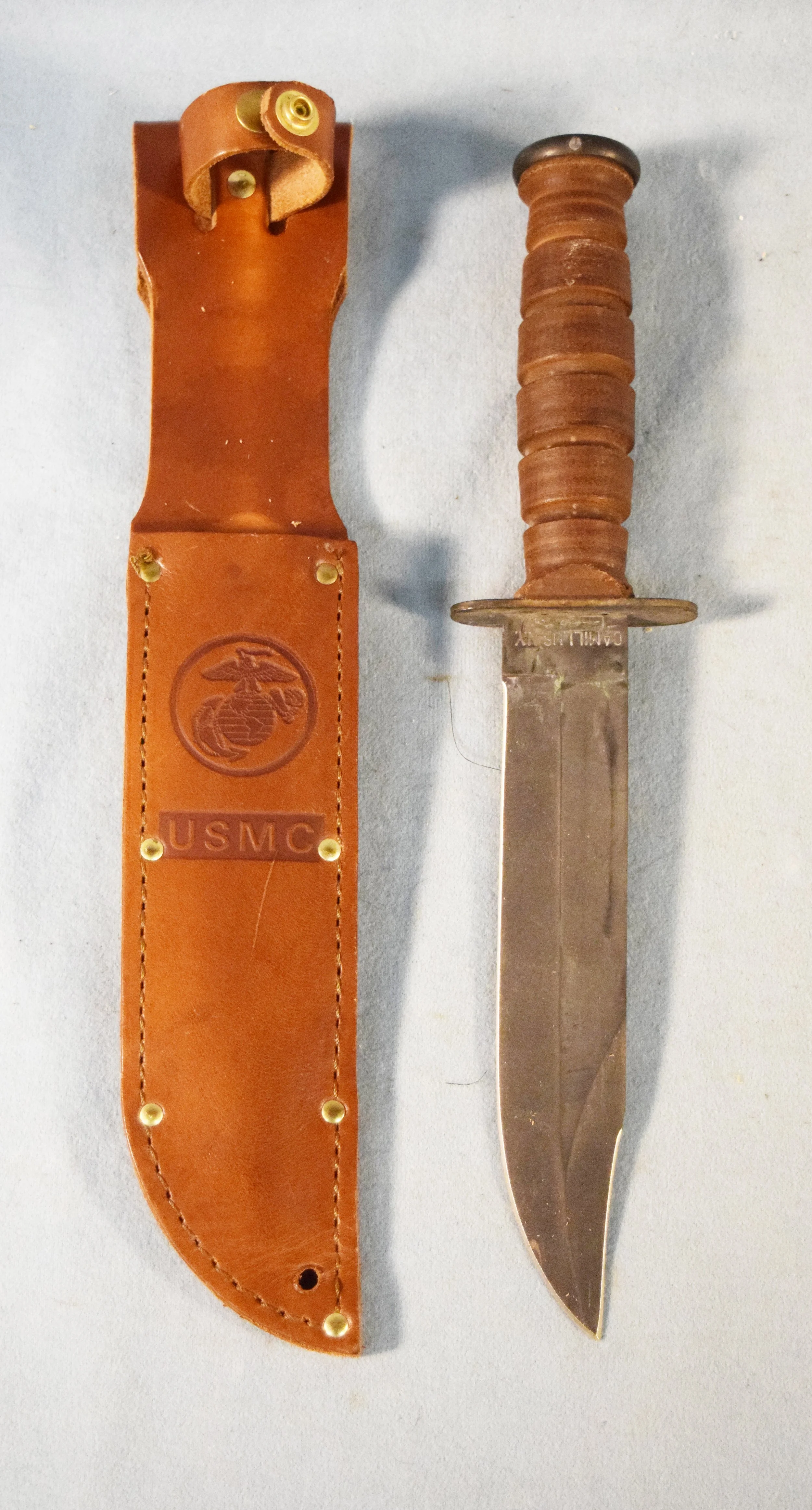 US Marine Corp knife & leather sheath, knife stamped U.S.M.C. Camillus, N.Y., 7" blade, sheath stamped with Marine Corp logo