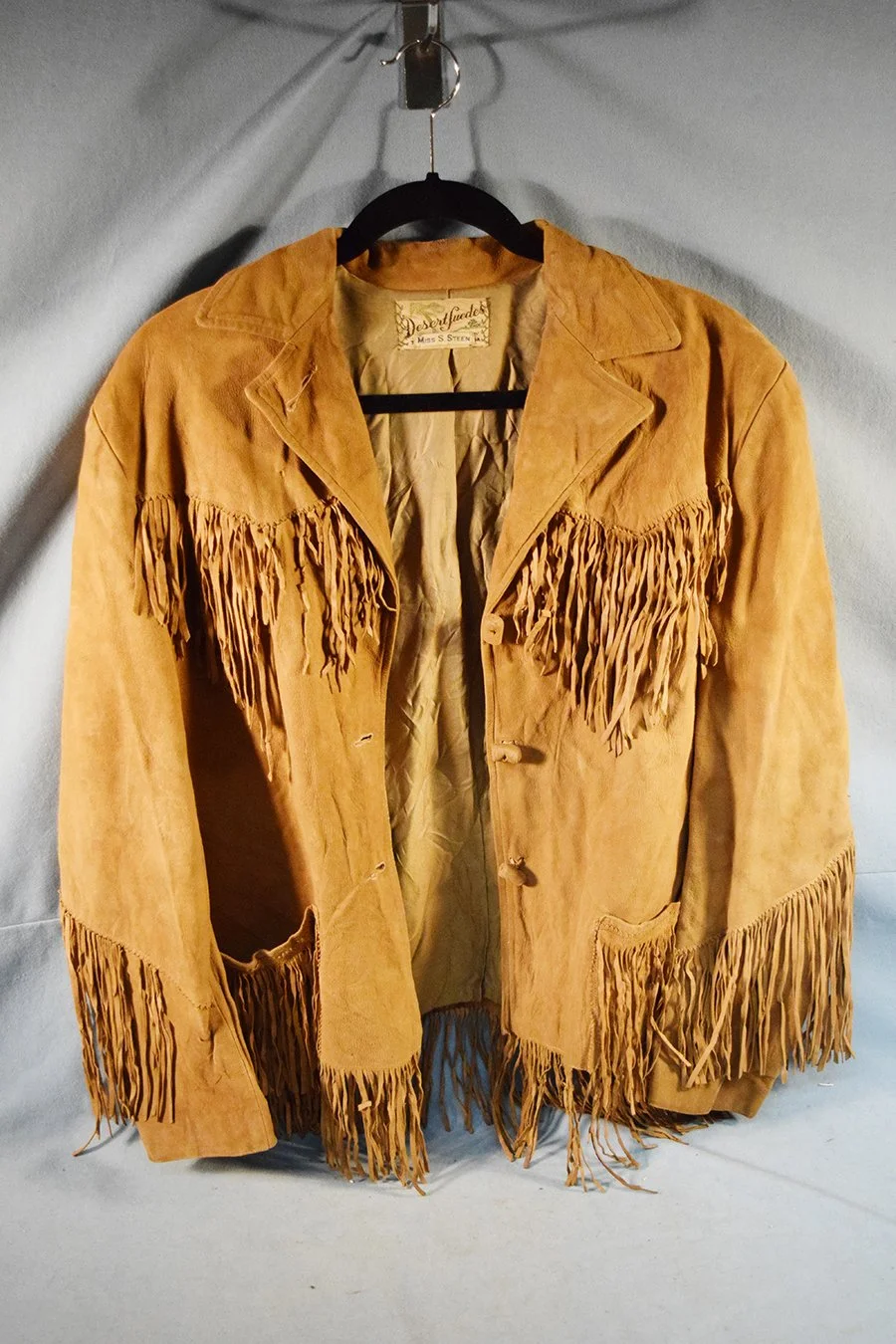 Fringed jacket by Desert Swedes, small tear on right pocket, right armpit and right rear back.
