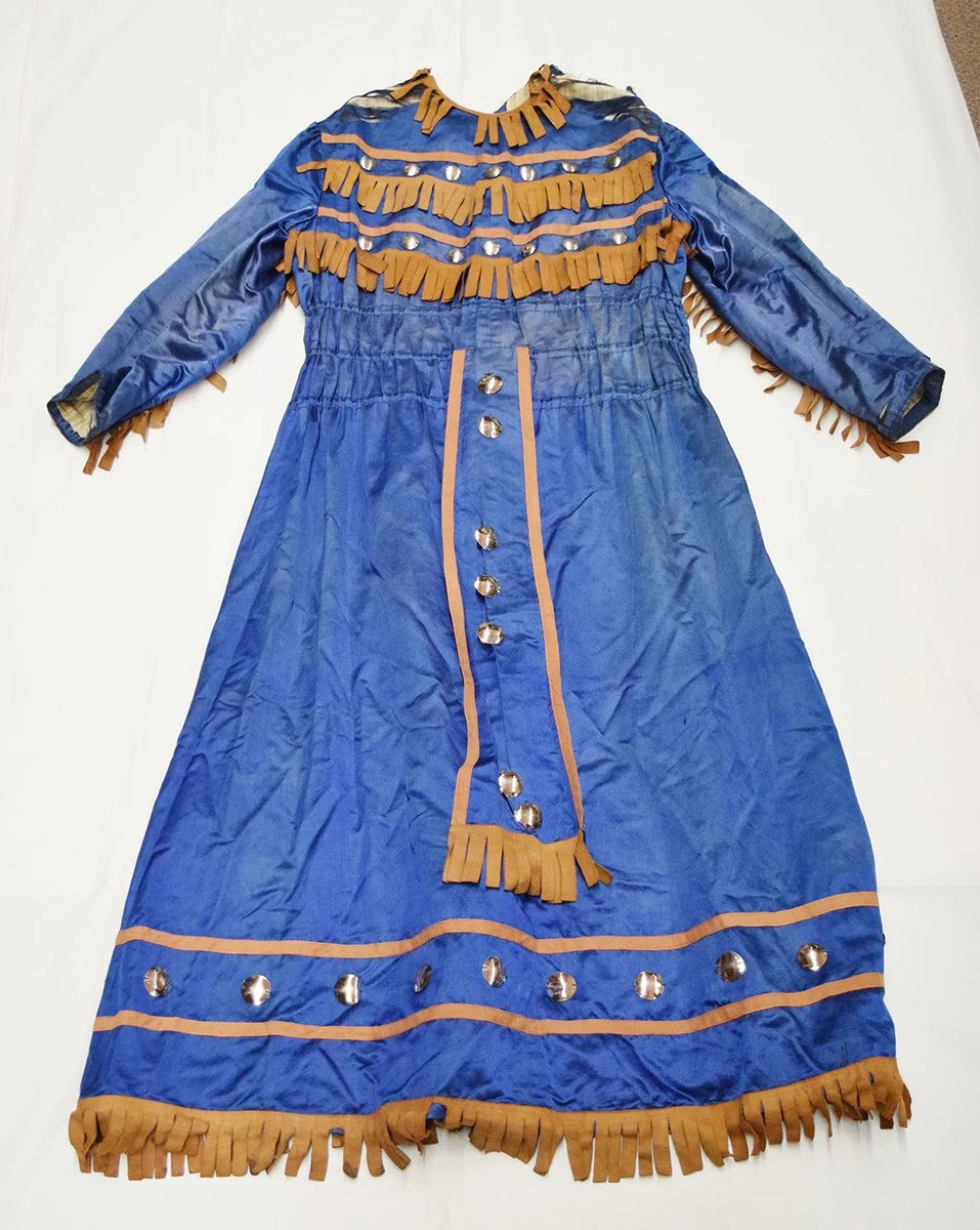 Authentic Buffalo Bill Cody Wild West Show dress, trunk containing dress was found in basement of a bank in Cincinatti, OH. Originally part of the Jerry & Vangie Lee collection. Sold to Gary Jacobson
