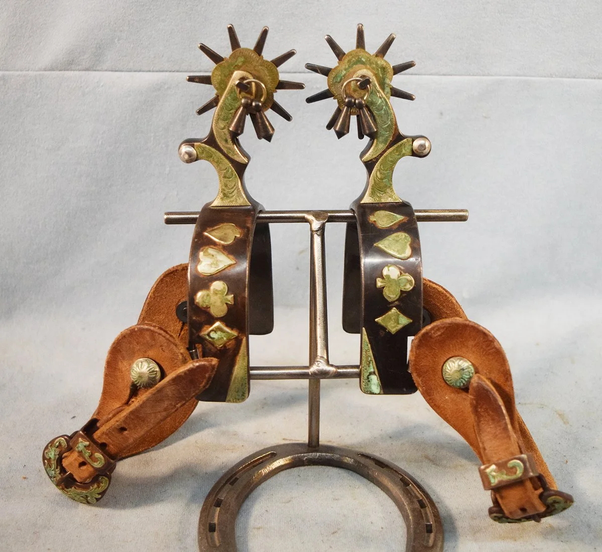 Kelly silver mounted card suit spurs with jungle bobs
