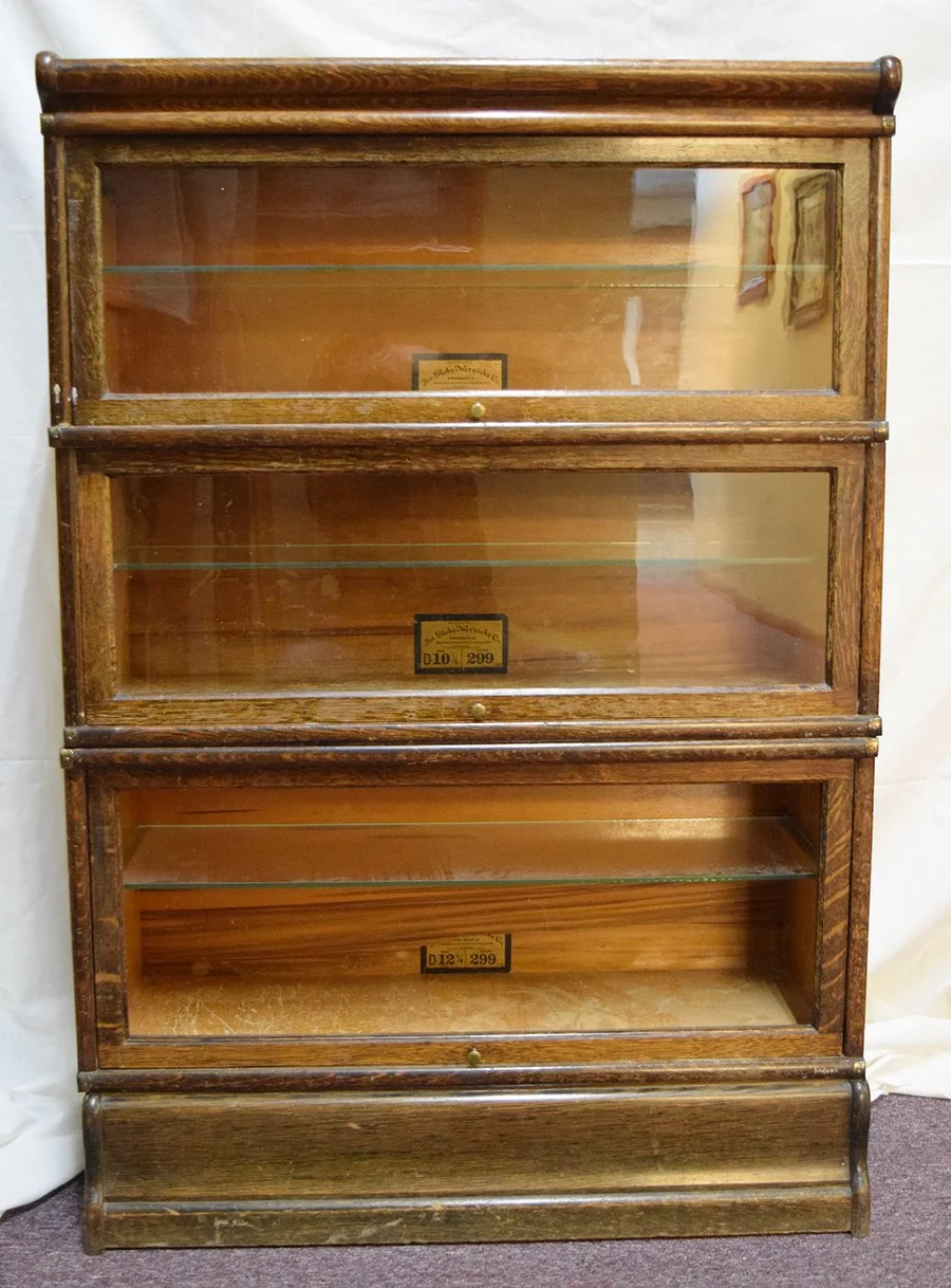The Globe-Wernicke Co. glass front oak barrister, 3 sections, 50" x 34" x 12", additional glass shelves added to each section, bottom section missing front glass