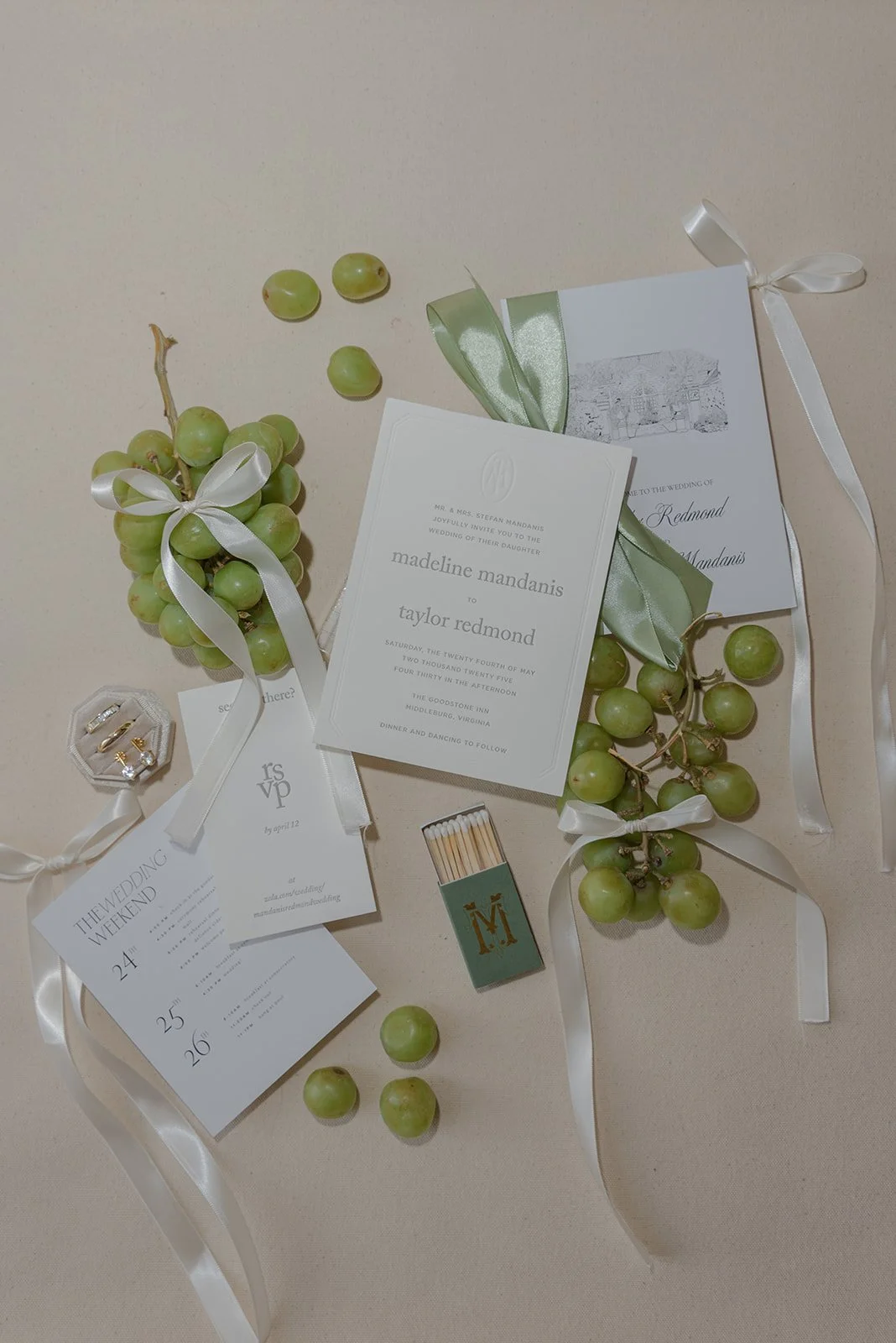 Wedding stationery, green grapes, ribbon, and paper details styled together for a spring wedding at Goodstone Inn.