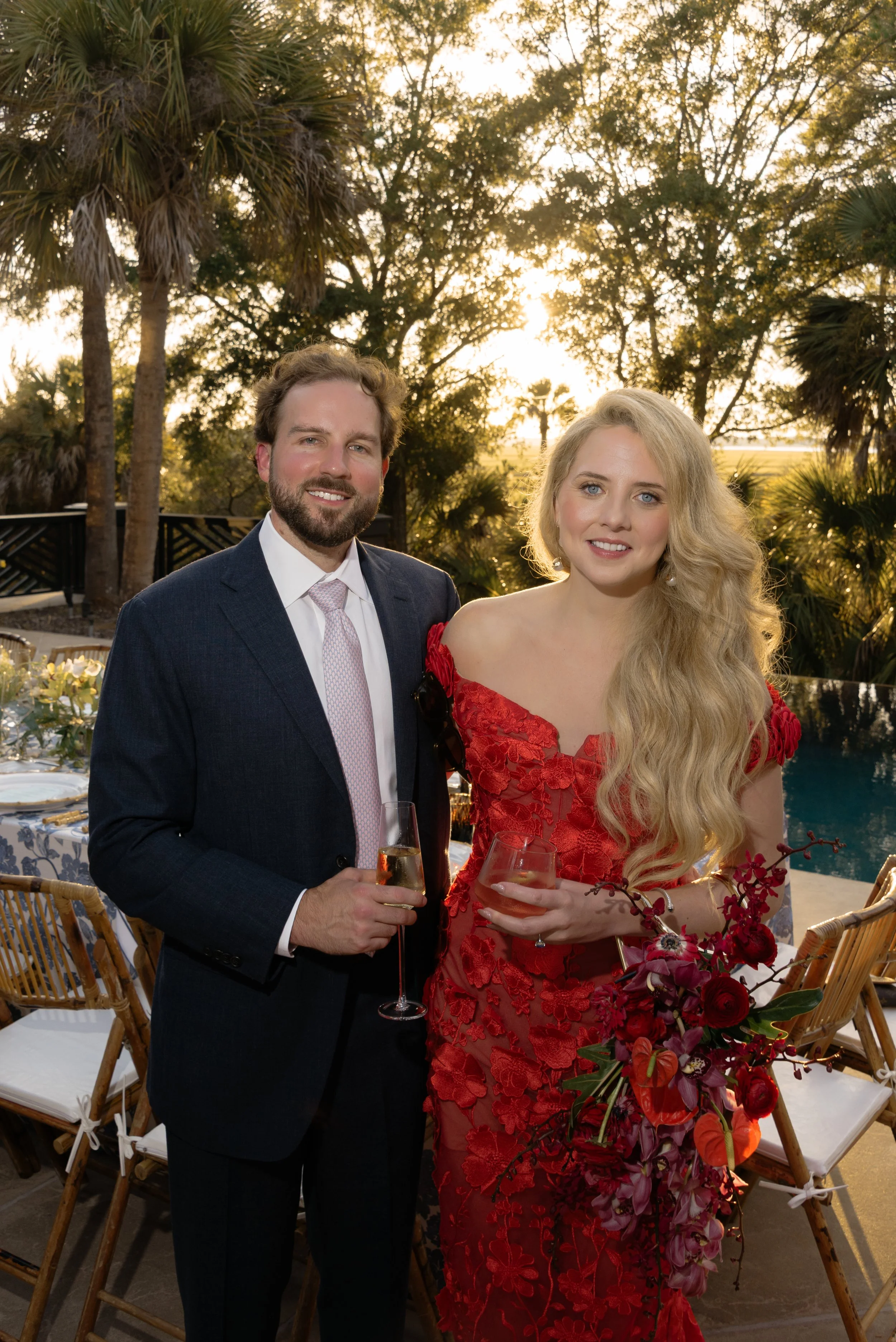 Katie and Trevor share a quiet portrait beside the pool before their rehearsal dinner on Kiawah Island.
