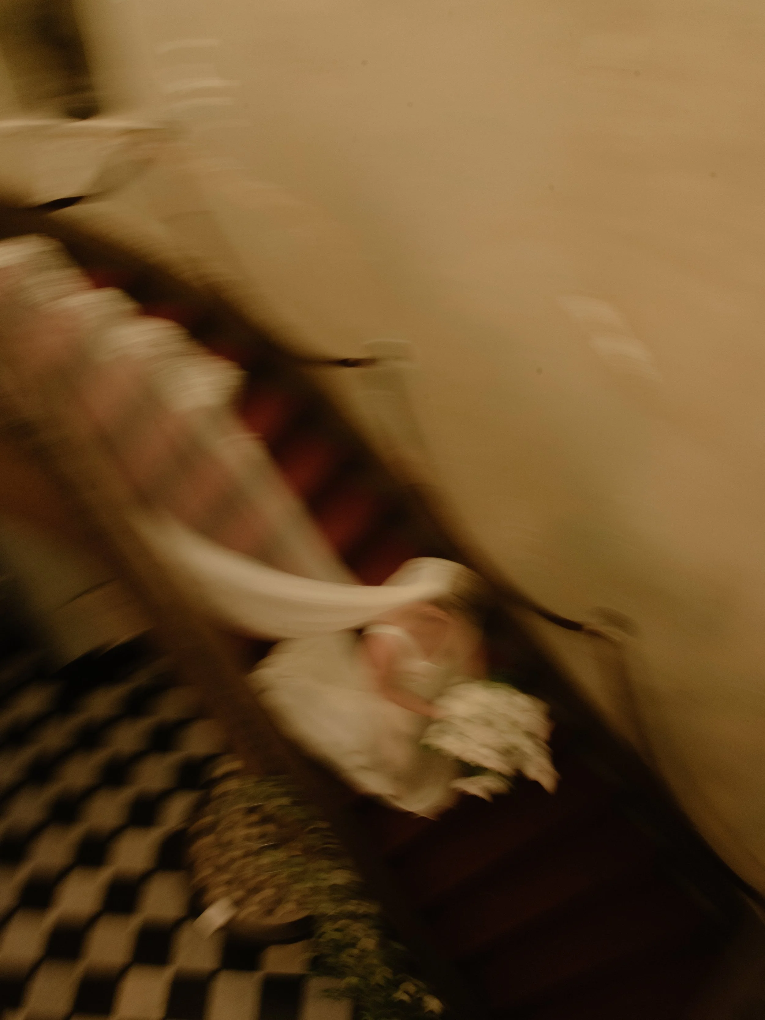 Intentional motion-blur wedding photograph capturing movement and atmosphere during a celebration.