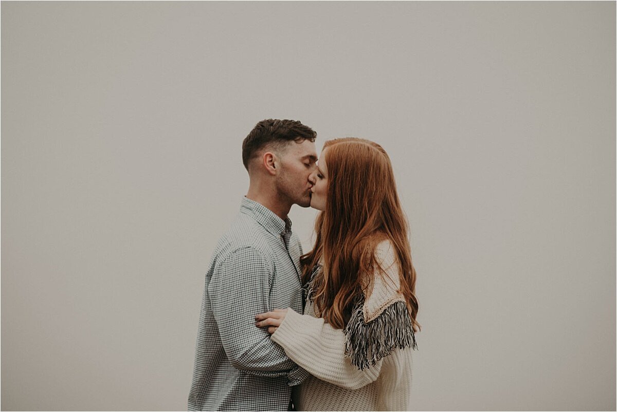  Allie’s red hair blazed against the white-out conditions of the fog in this Lookout Mountain engagement session by Taylor English Photography 