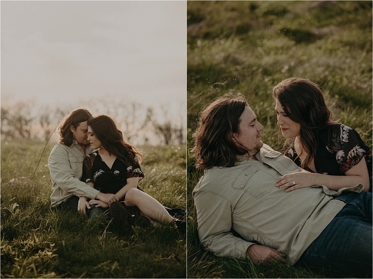A gorgeous sunlit field the couple lays down in for their engagement photos