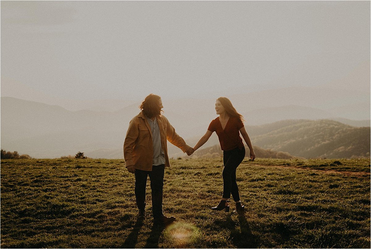 Sun-filled blurry moments at this mountain engagement session in western North Carolina