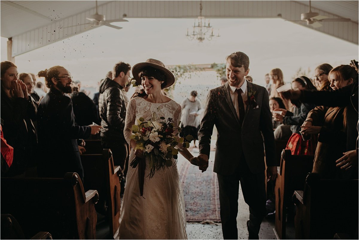  The guests threw flower confetti as the bride and groom came back down the aisle. 