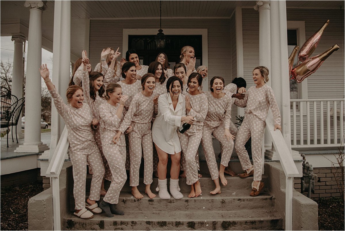 The bridal party wears brown and white polka dot pajamas to get ready in