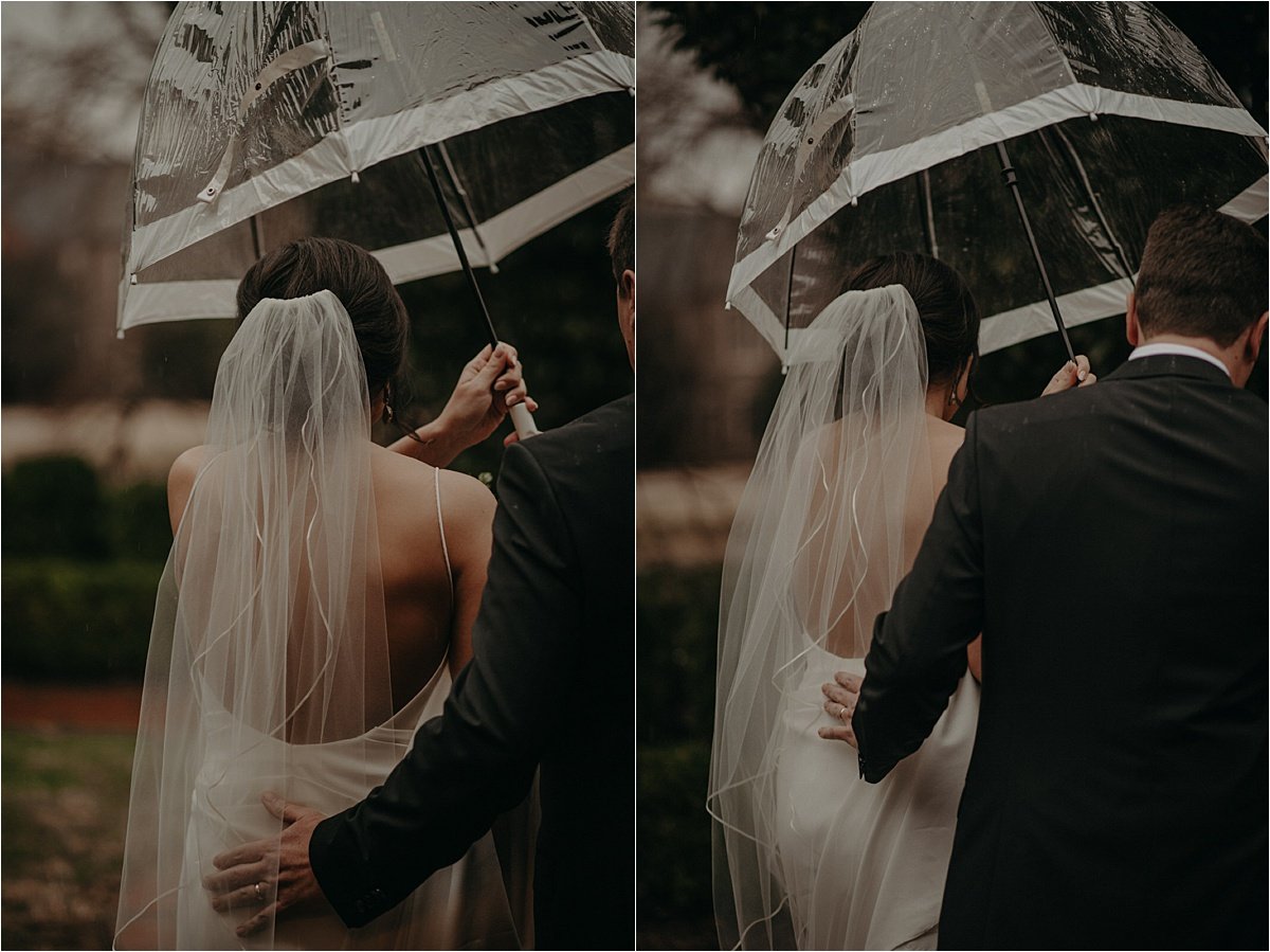 The bride's father shields her with a clear umbrella on their way to the ceremony at Patten Chapel