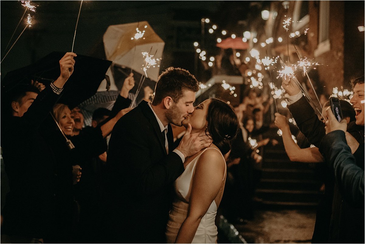 A beautiful sparkler exit for the bride and groom outside of the Church on Main