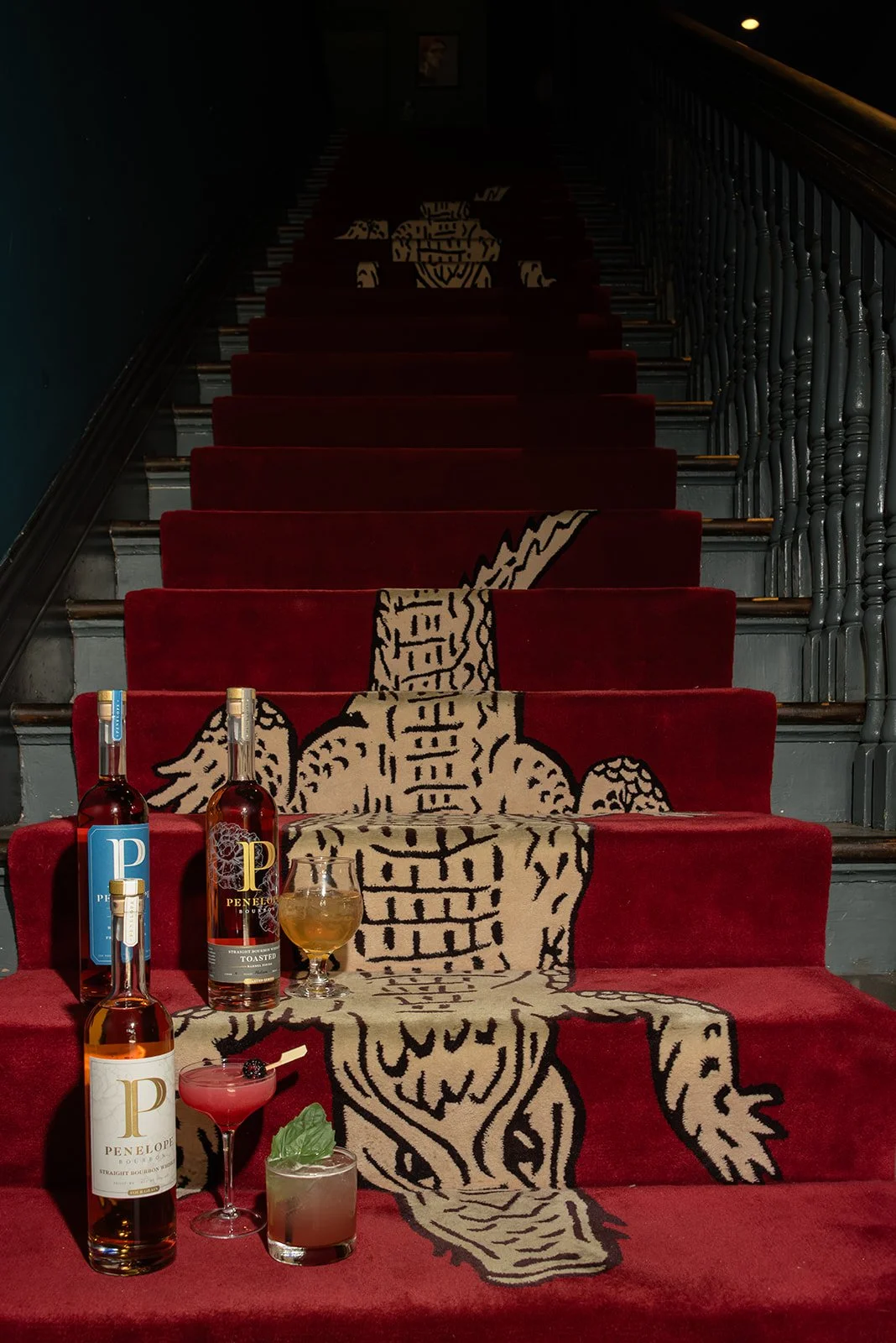 Editorial event details for Garden and Gun Magazine featuring cocktails and a dramatic red carpet installation at a creative celebration.