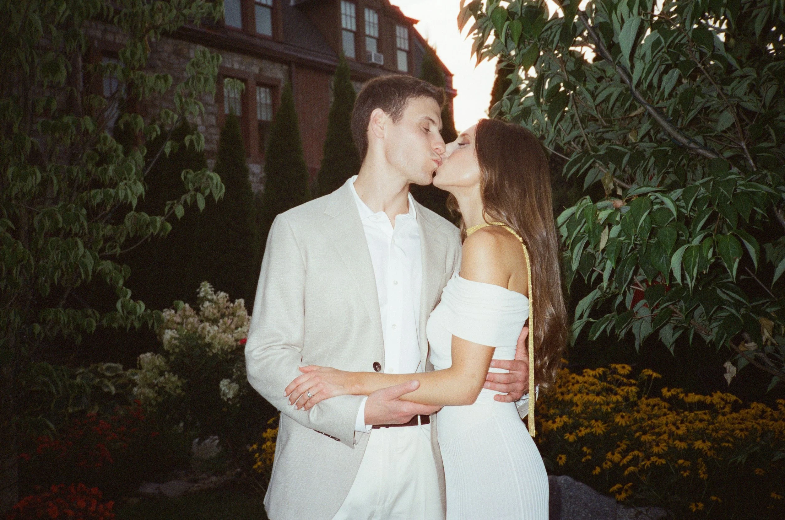 Jennie and Will embrace outside The Abbey Inn & Spa before their Hudson Valley rehearsal dinner.