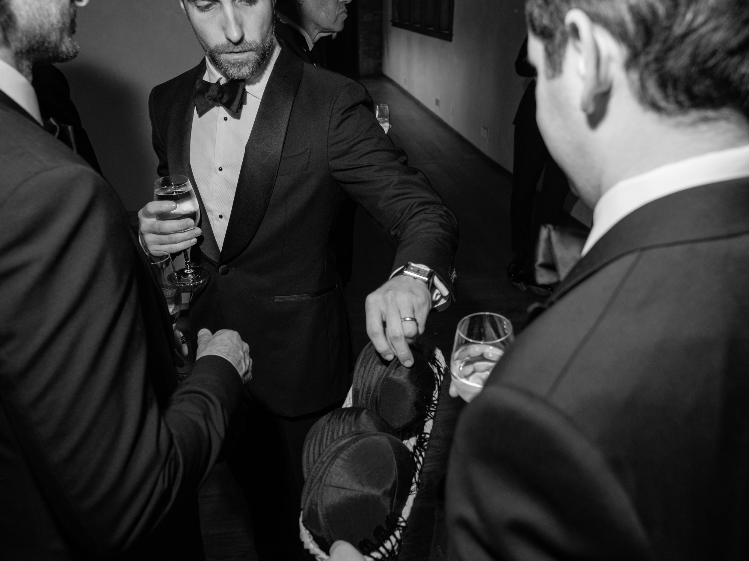 Family members pass out yamakas to the men before the Ketubah signing tradition begins. 