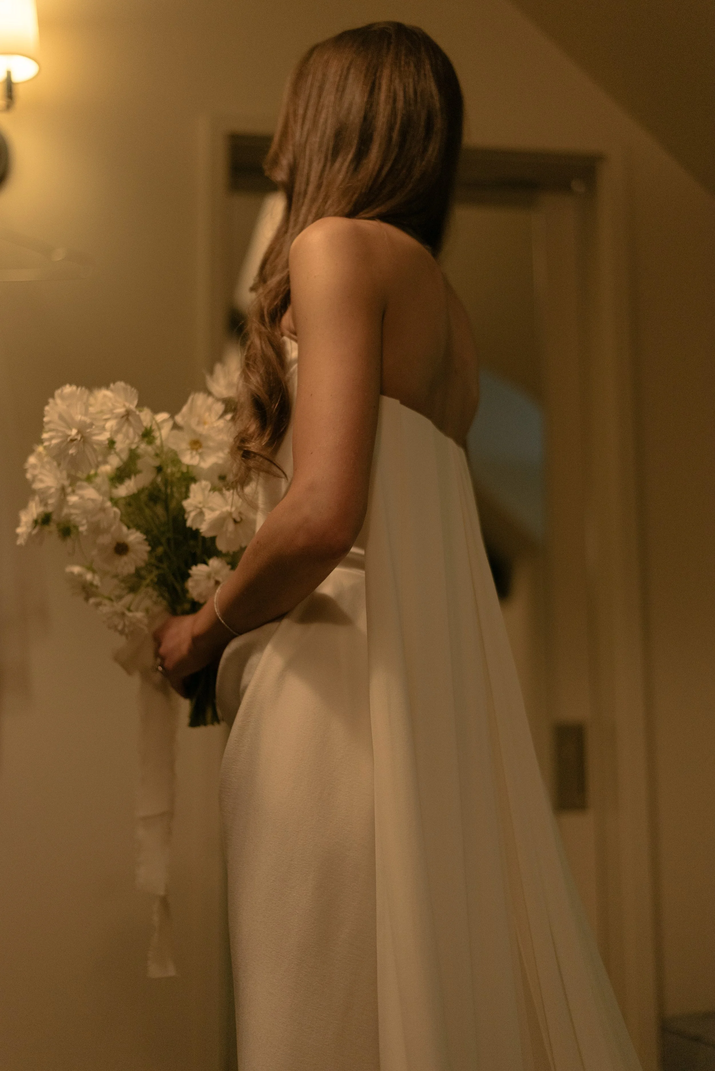 Bride wearing the Vivienne Westwood Galaxy cape before her luxury Hudson Valley wedding ceremony.