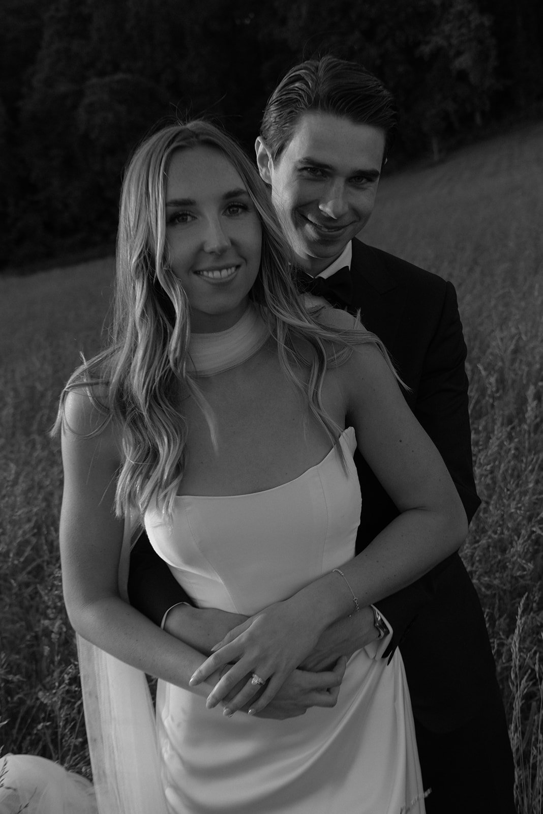 Black-and-white portrait of the bride smiling during wedding portraits at Goodstone Inn.
