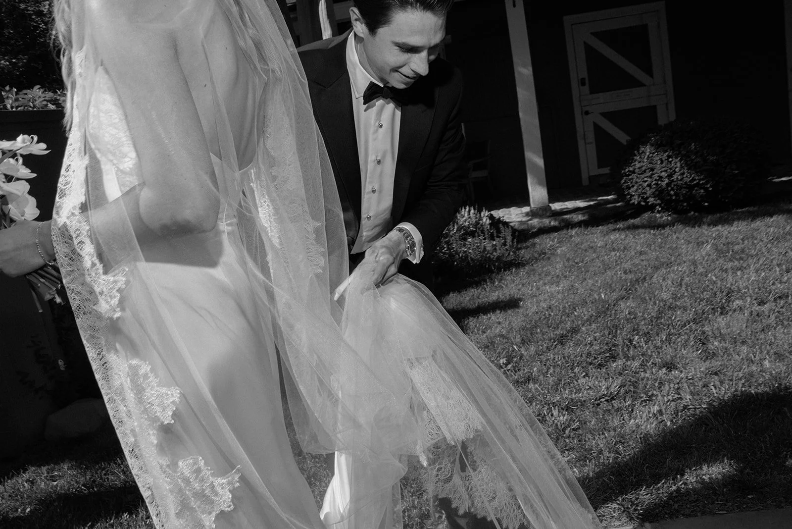 Black-and-white close-up of the bride and groom walking together after their Goodstone Inn ceremony.