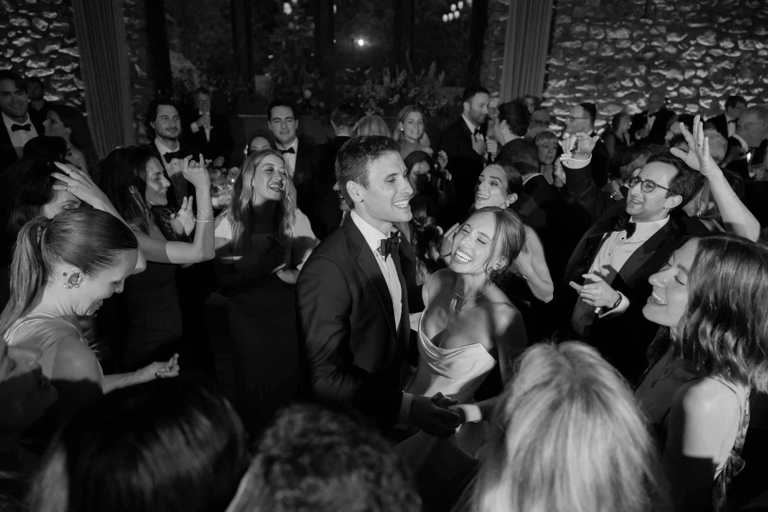 Black-and-white crowd scene capturing the energy of Jennie and Will’s late-night wedding celebration.