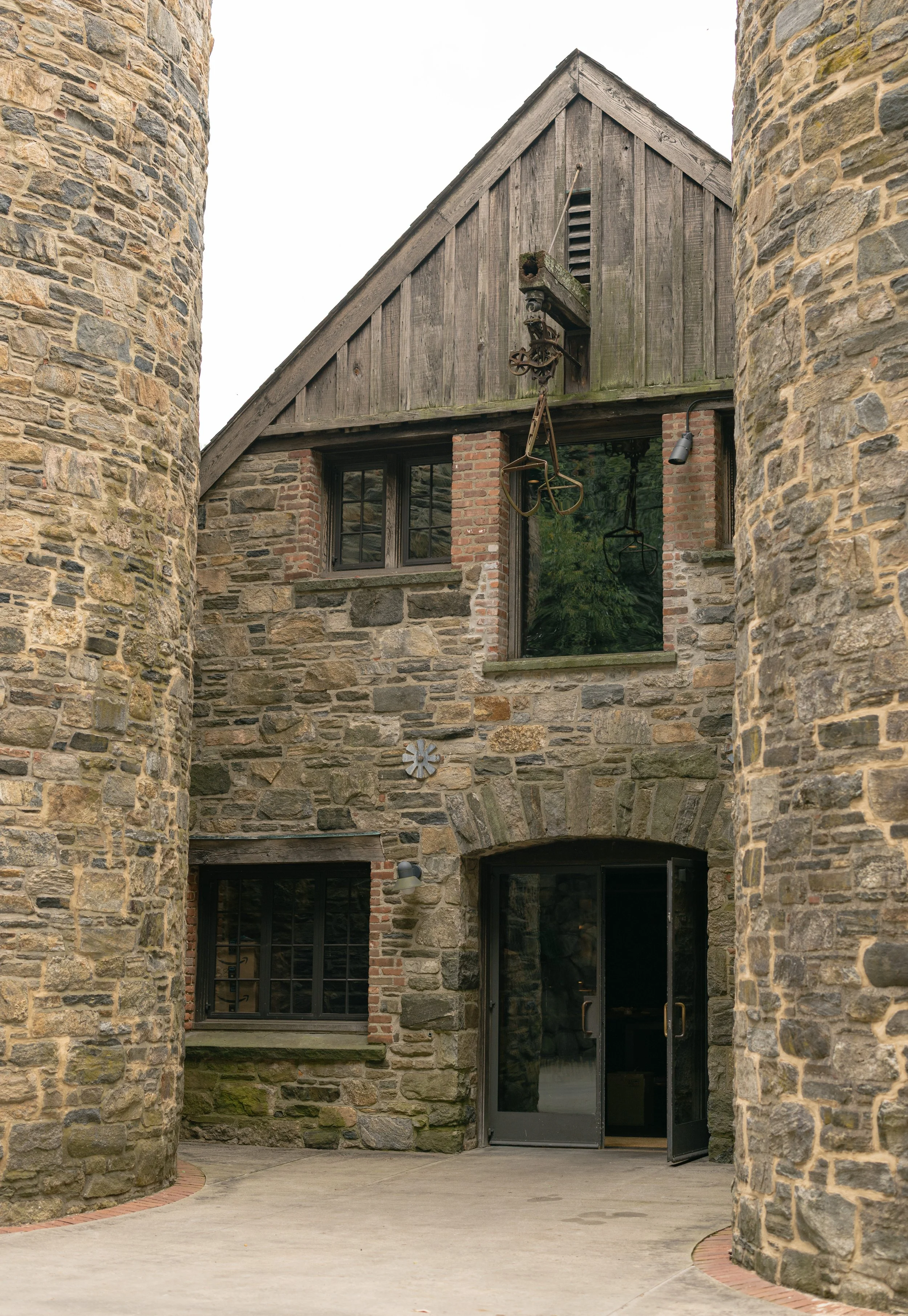The historic stone buildings and pastoral architecture of Blue Hill at Stone Barns during a Hudson Valley wedding weekend.