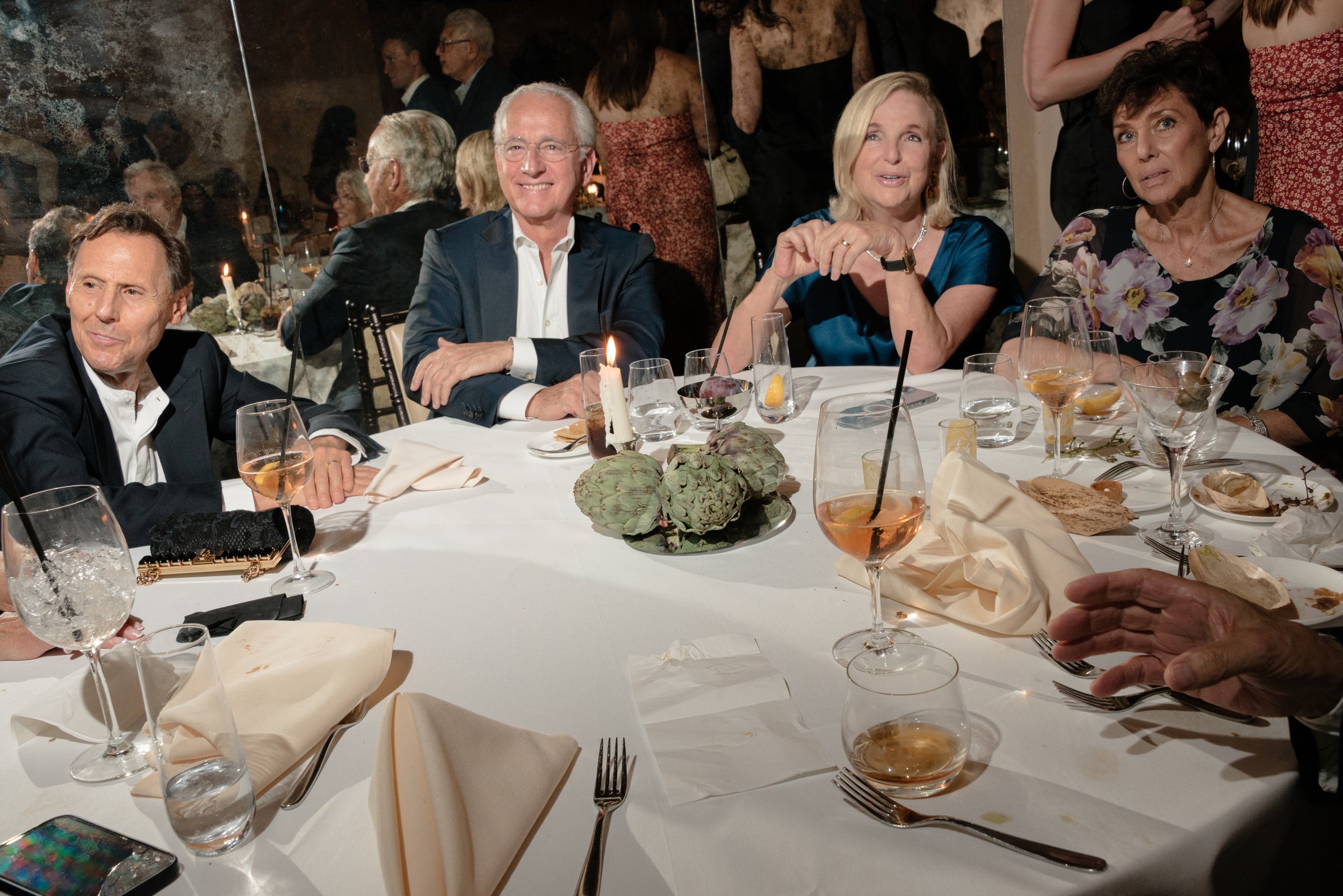 Family and friends gathered around the table during Jennie and Will’s intimate rehearsal dinner.
