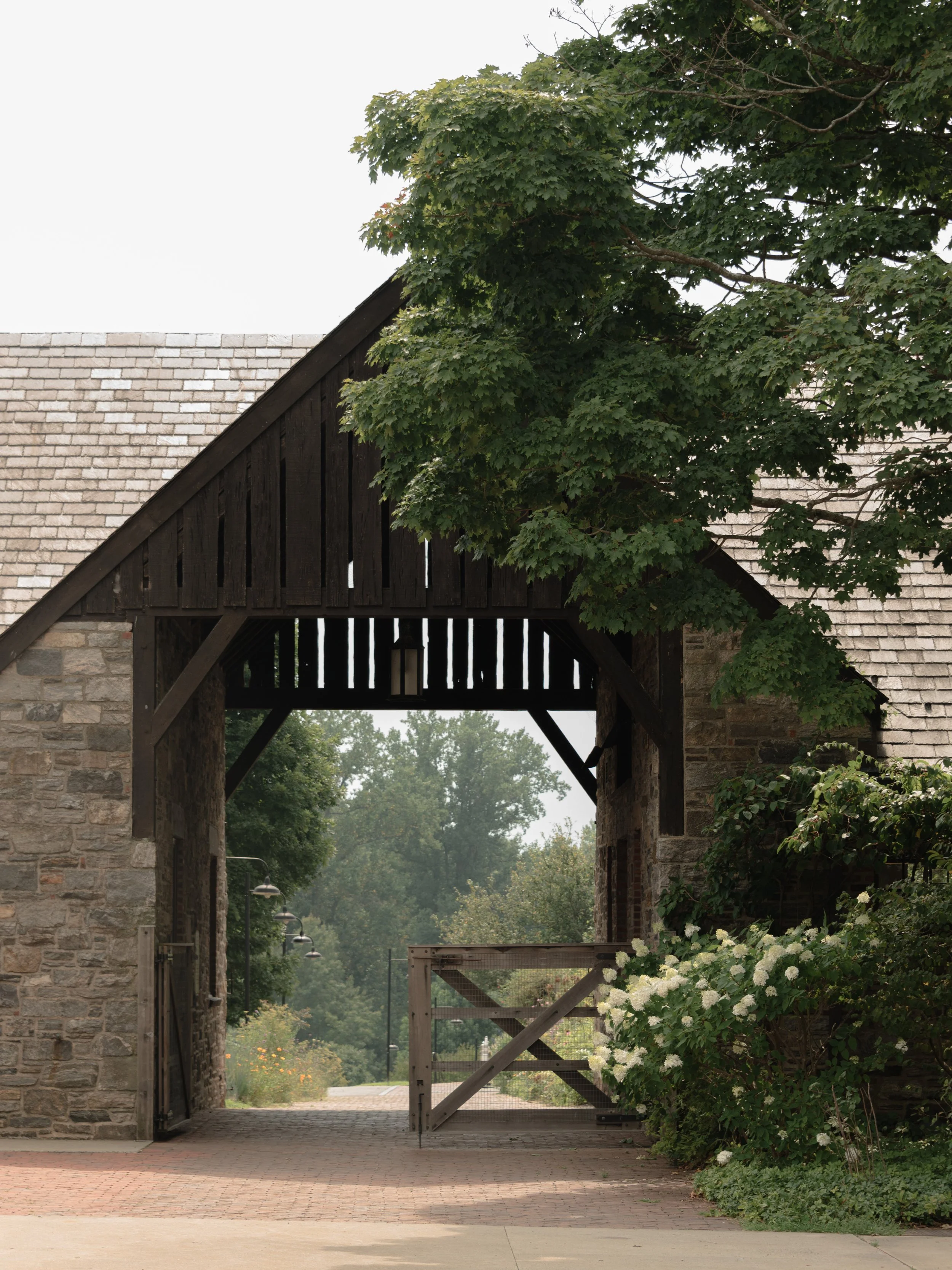 Historic stone architecture and gardens at Blue Hill at Stone Barns, a luxury wedding venue in Tarrytown, New York.