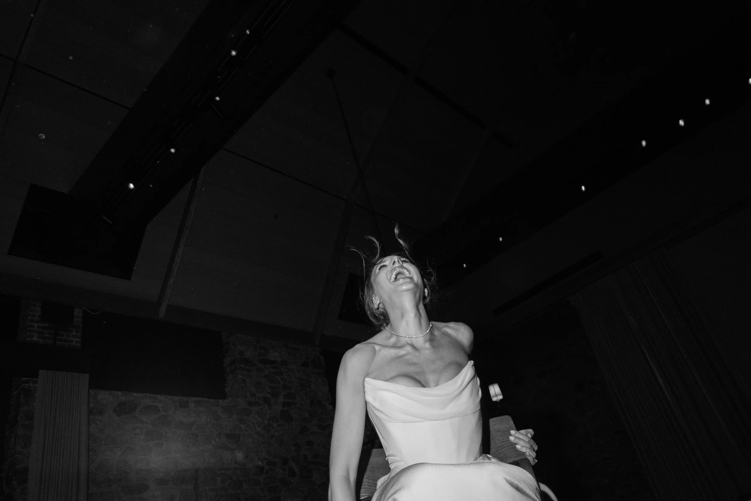 Jennie is lifted up during the Hora at her reception