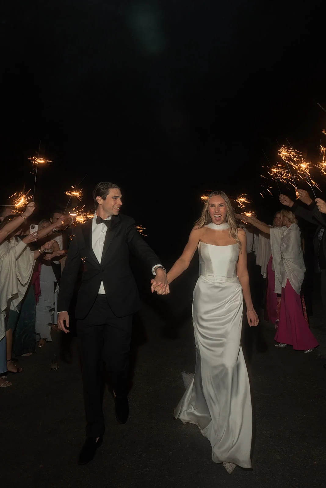 Bride and groom exit their late-night wedding reception with a sparkler exit at Goodstone Inn