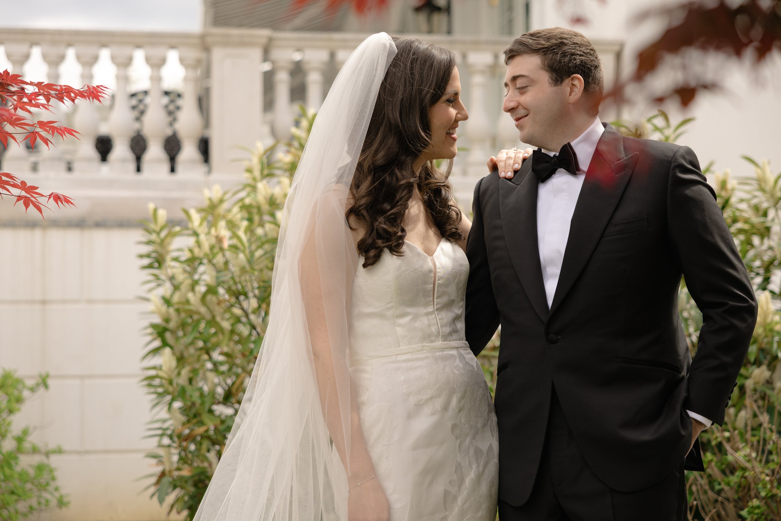 Bride and groom smiling together during their spring wedding at Shadowbrook at Shrewsbury in New Jersey.
