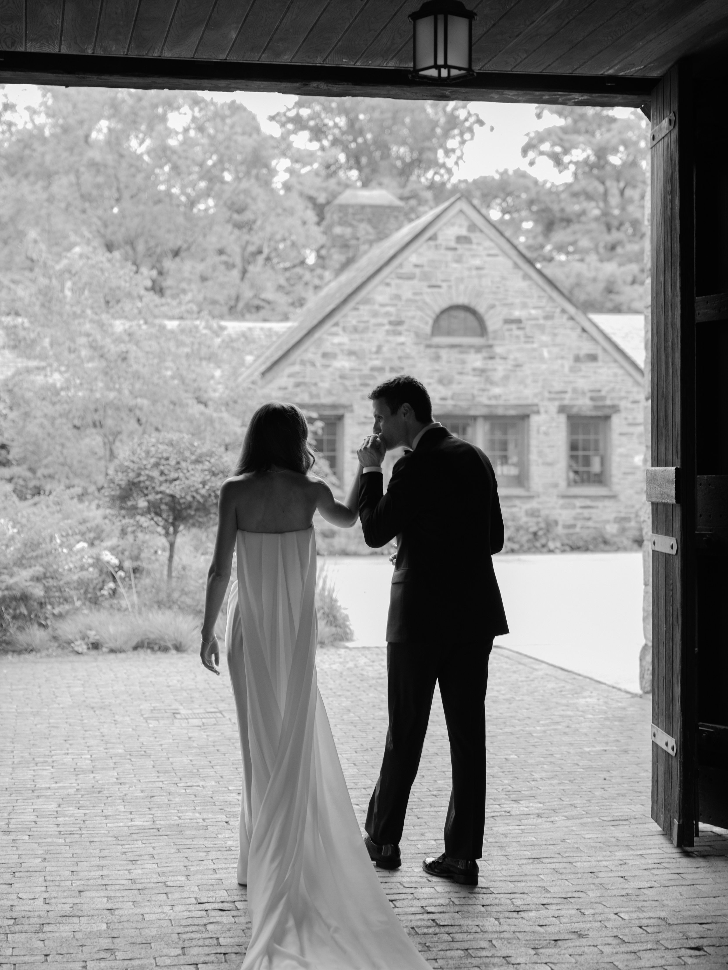 Newlyweds surrounded by the stone architecture and gardens of Blue Hill at Stone Barns in Hudson Valley.