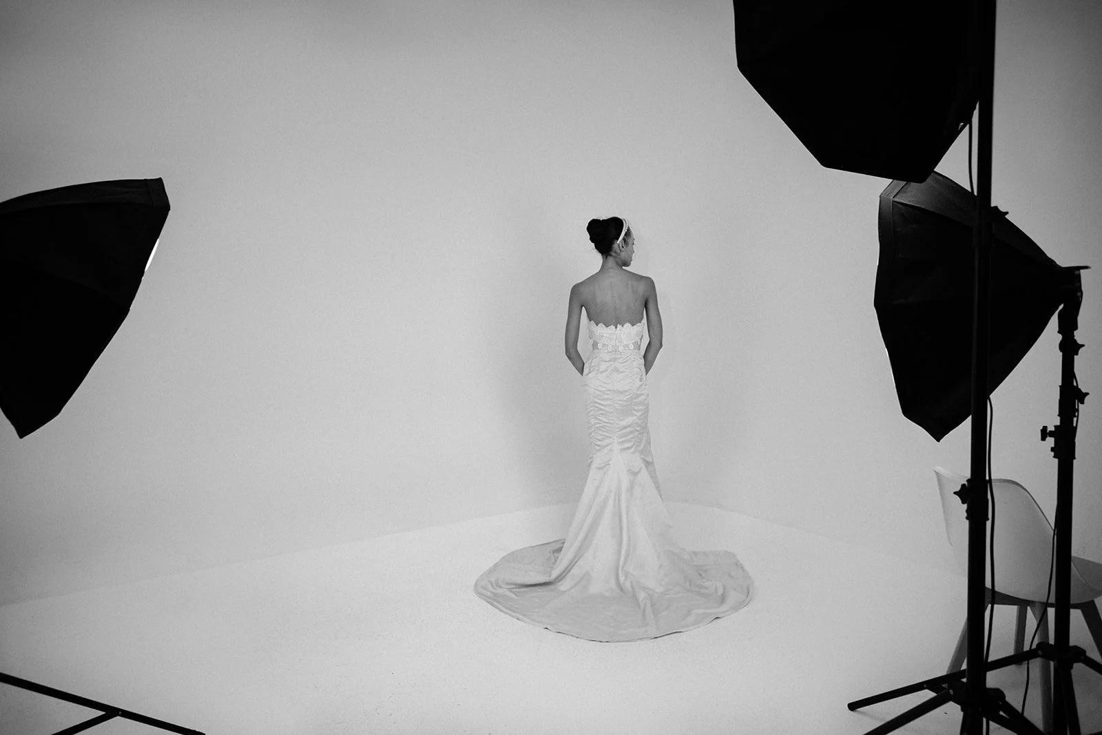 Minimalist editorial fashion portrait of a model in a sculptural wedding gown designed by Victor de Souza 2025, photographed at Victor's in-house studio in New York City. 