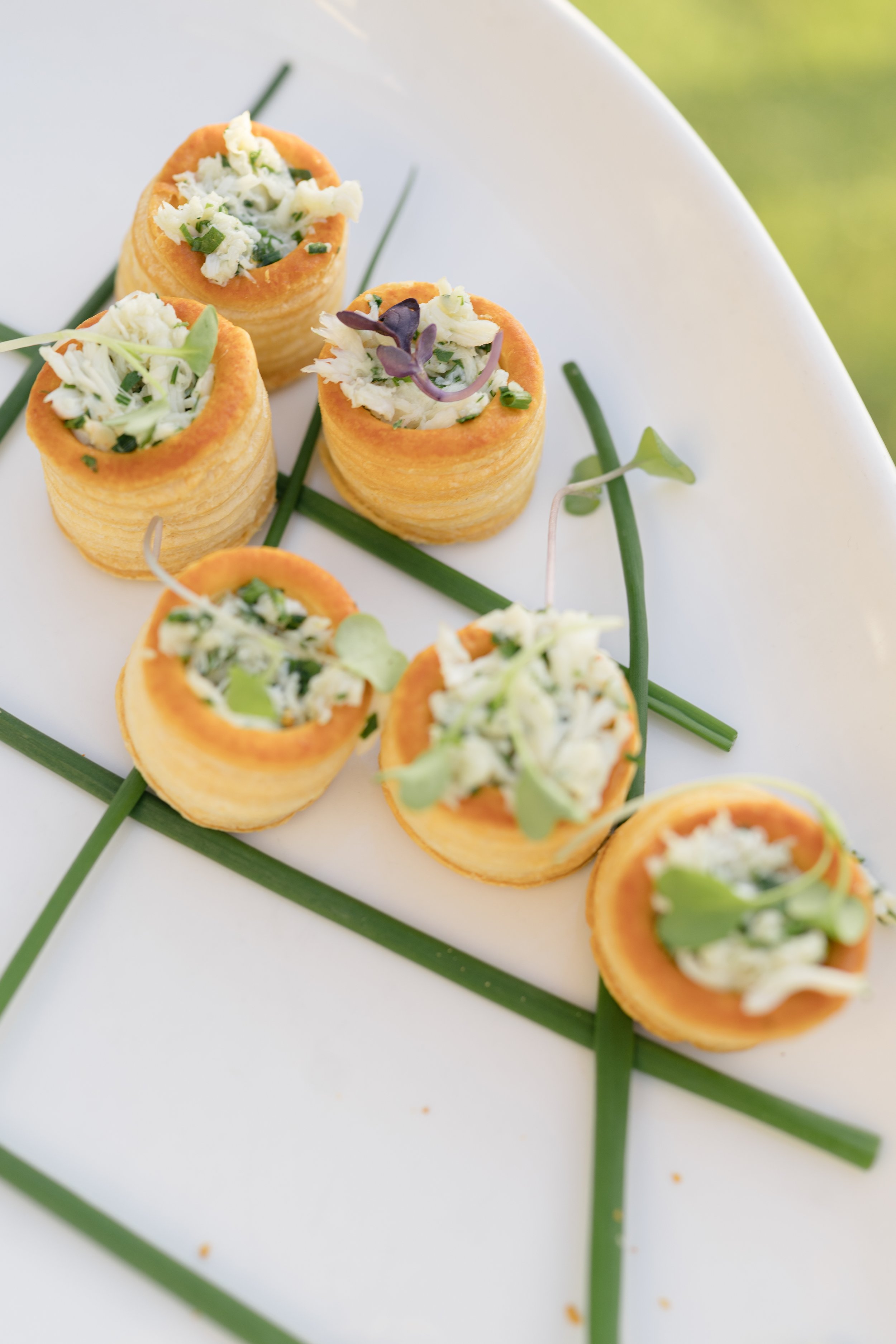 Colorful passed appetizers arranged on a white platter during the Kiawah Island wedding cocktail hour.