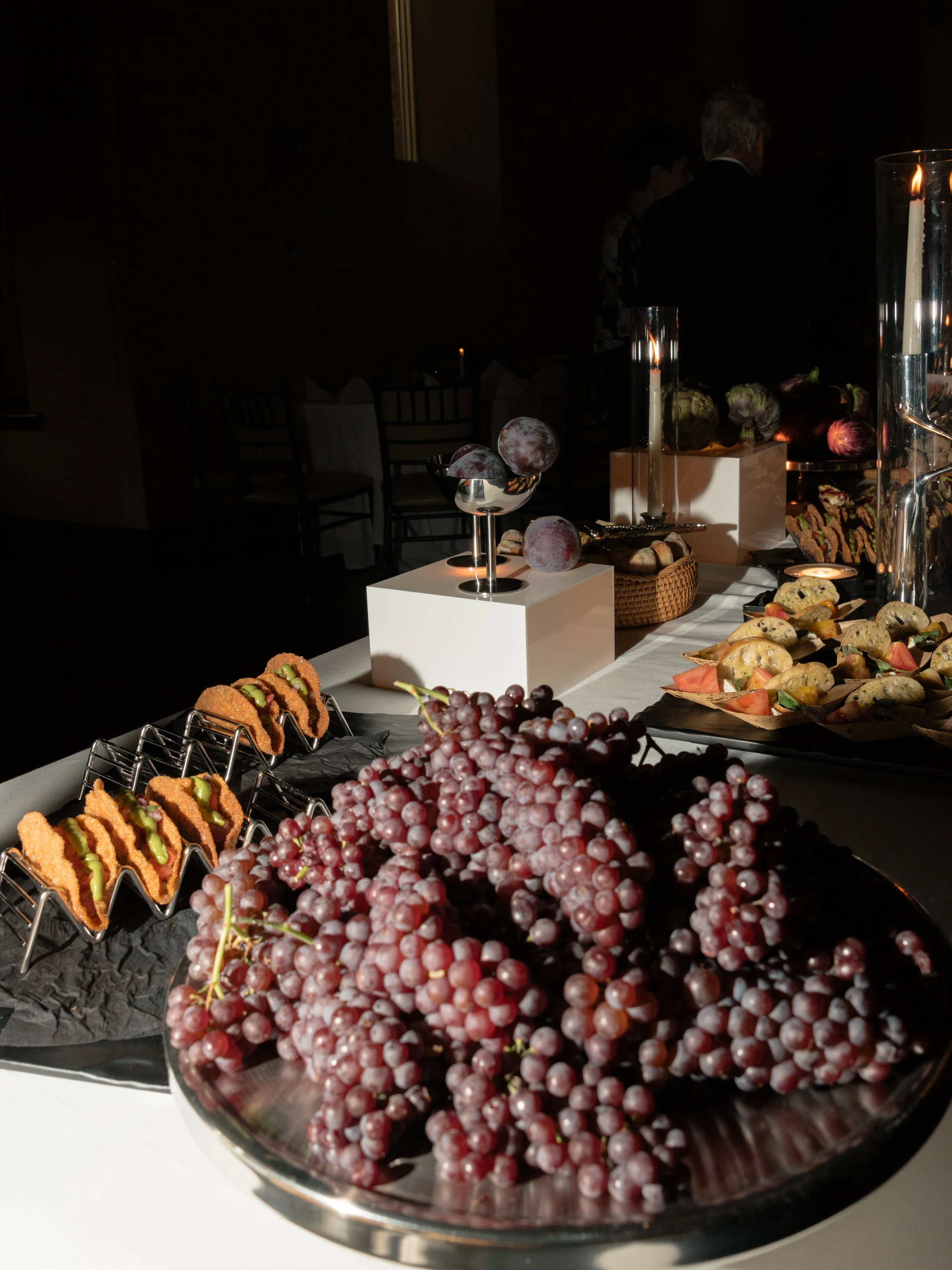 Abundant fruit and hors d’oeuvres displayed for guests during the rehearsal dinner.
