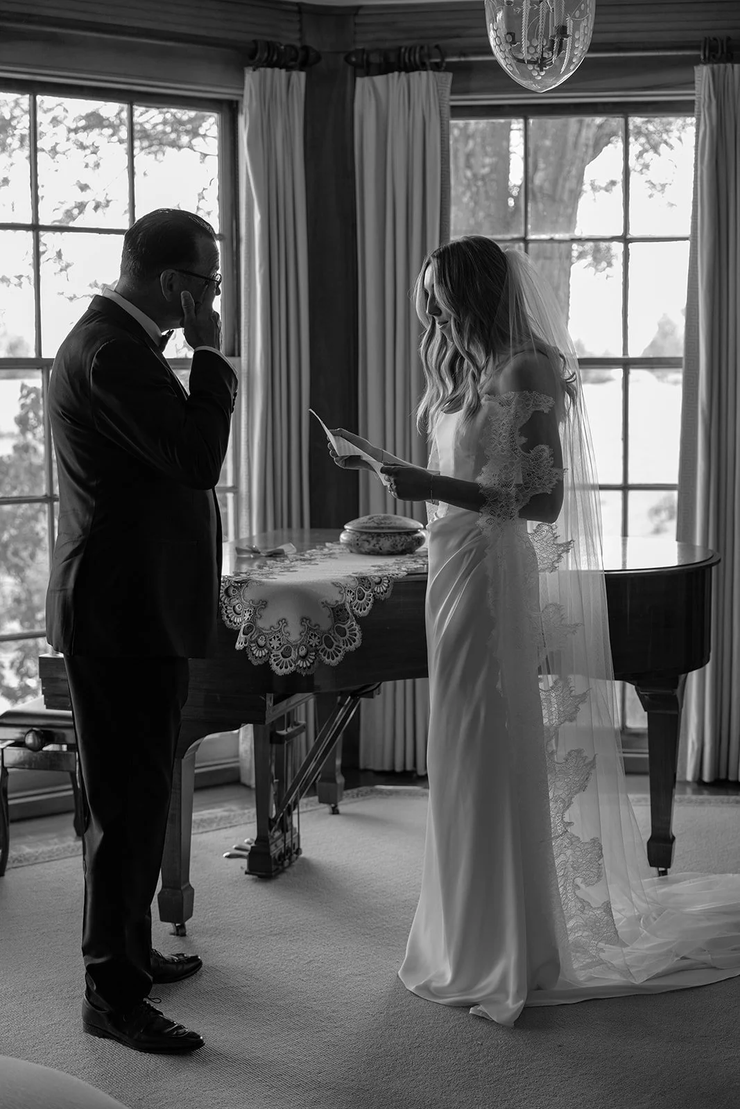 Black-and-white candid of wedding-day preparations inside the historic Manor House at Goodstone Inn.