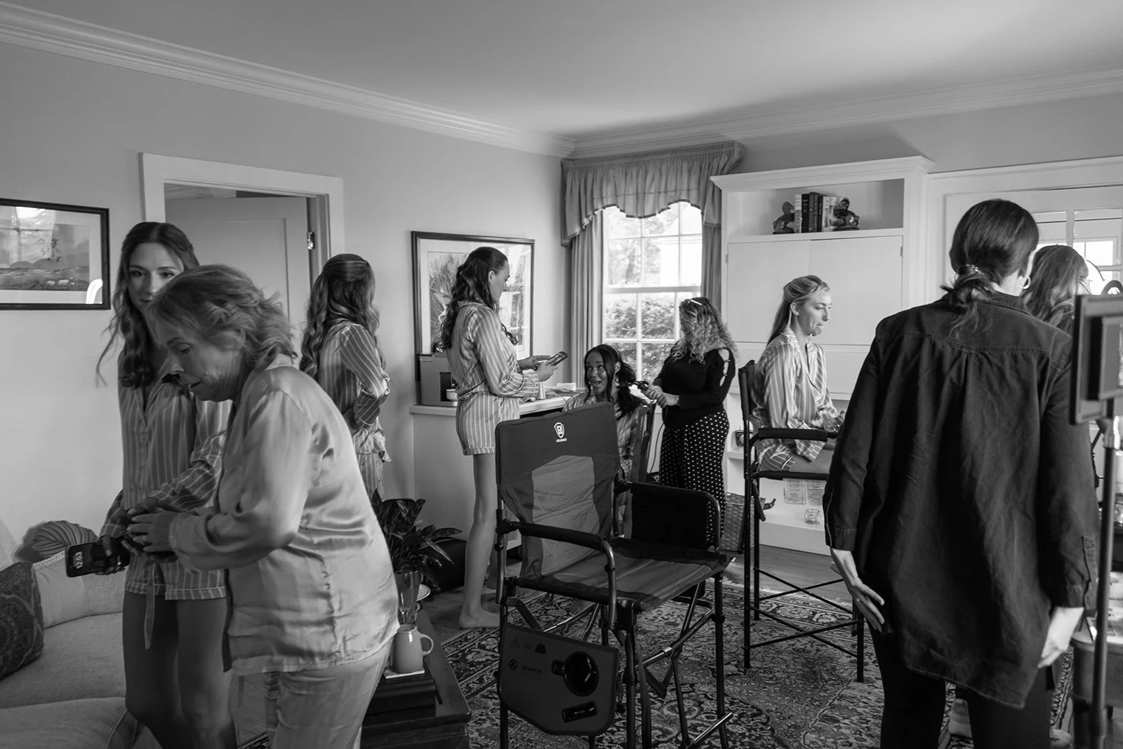 Black-and-white candid of wedding-day preparations inside the Manor House at Goodstone Inn.
