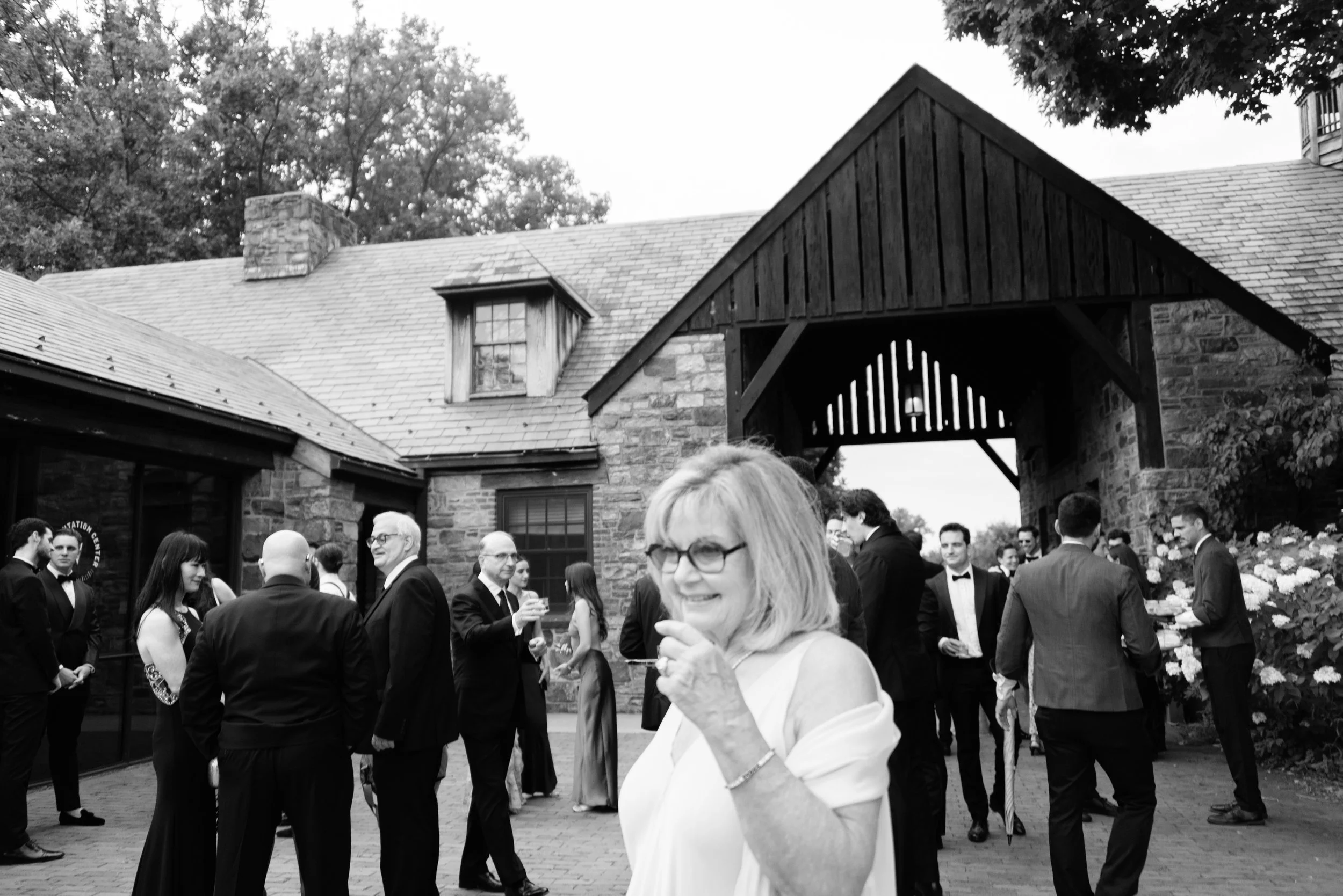 Documentary photography of guests arriving to Blue Hill at Stone Barns before the wedding ceremony.