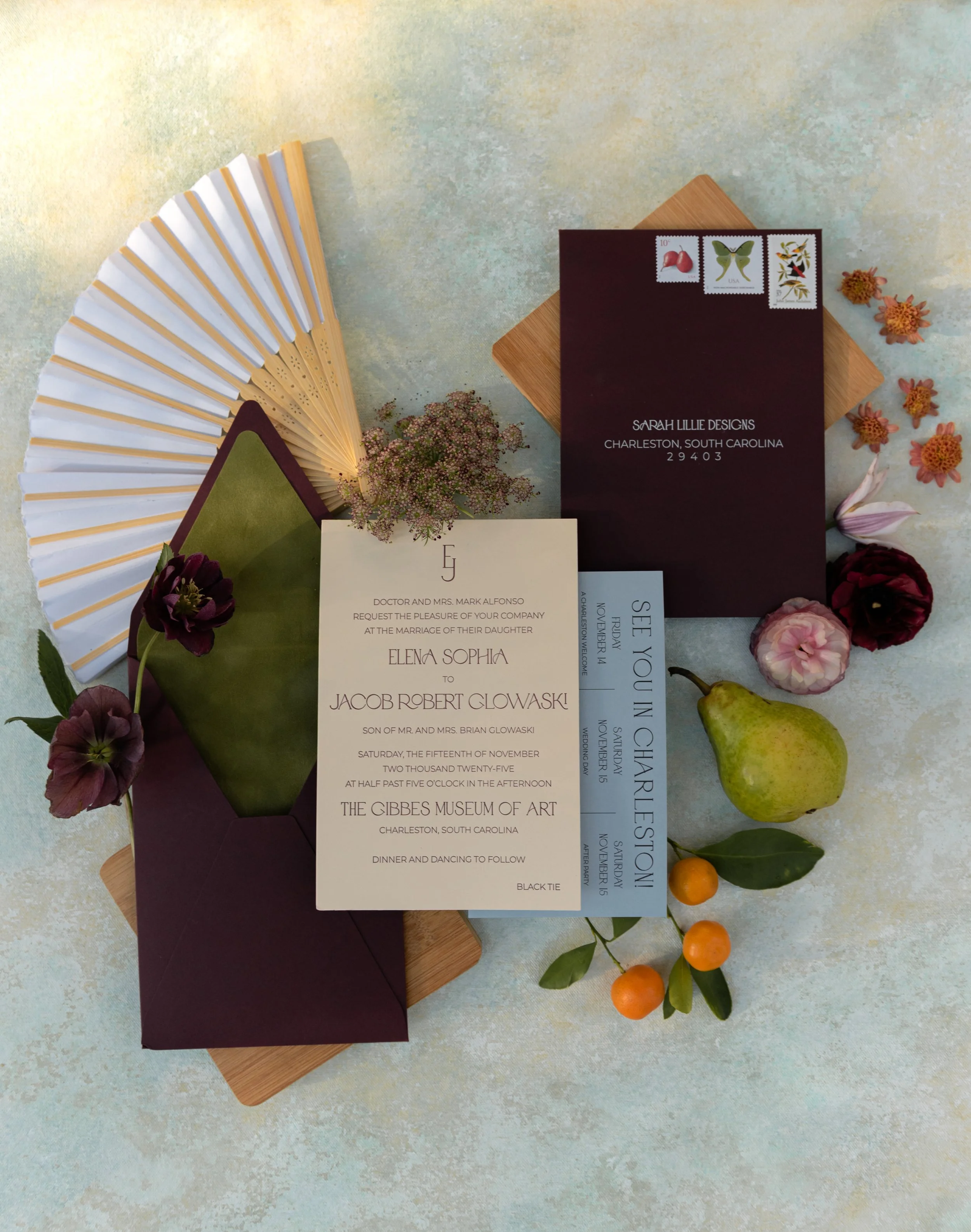 Artfully arranged wedding stationery, invitation suite, and colorful floral details styled for a thoughtfully designed celebration.